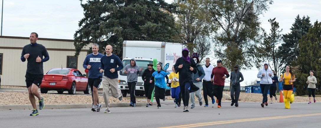 Participants of the 8th Annual Dreadful Dash race against each other Oct. 31, 2013, on Buckley Air Force Base, Colo. More than 30 runners participated in the costume competition and 5K race. (U.S. Air Force photo by Airman 1st Class Riley Johnson/Released)