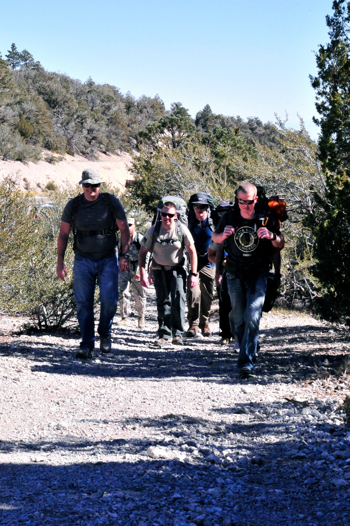 LAS VEGAS, Nev. -- Members of the 432nd Operations Support Squadron begin hiking during a ruck march in the Spring Mountains National Recreation Area to honor fallen security forces Airmen Oct. 18.  Approximately a dozen team members hiked 10 kilometers as part of a detached team for the annual event, which takes place at Camp Bulls, Texas, annually. (U.S. Air Force photo by 1st Lt. S.S./released)