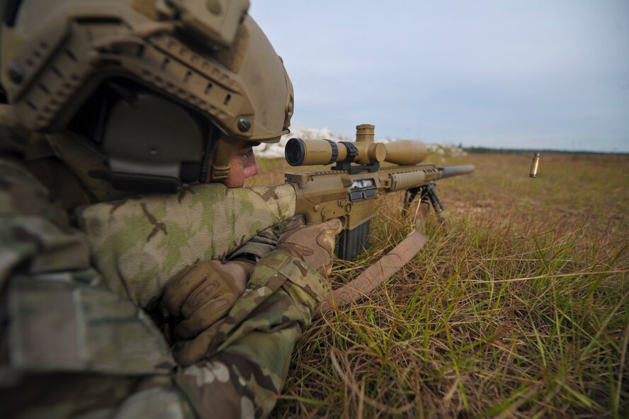 An Army Special Forces member fires an M110 semi-automatic sniper system on Eglin Range,Fla., Oct. 30, 2013. Hurlburt Field instructors trained Army members during a special tactics training exercises. (U.S. Air Force Photo/Staff Sgt. John Bainter)