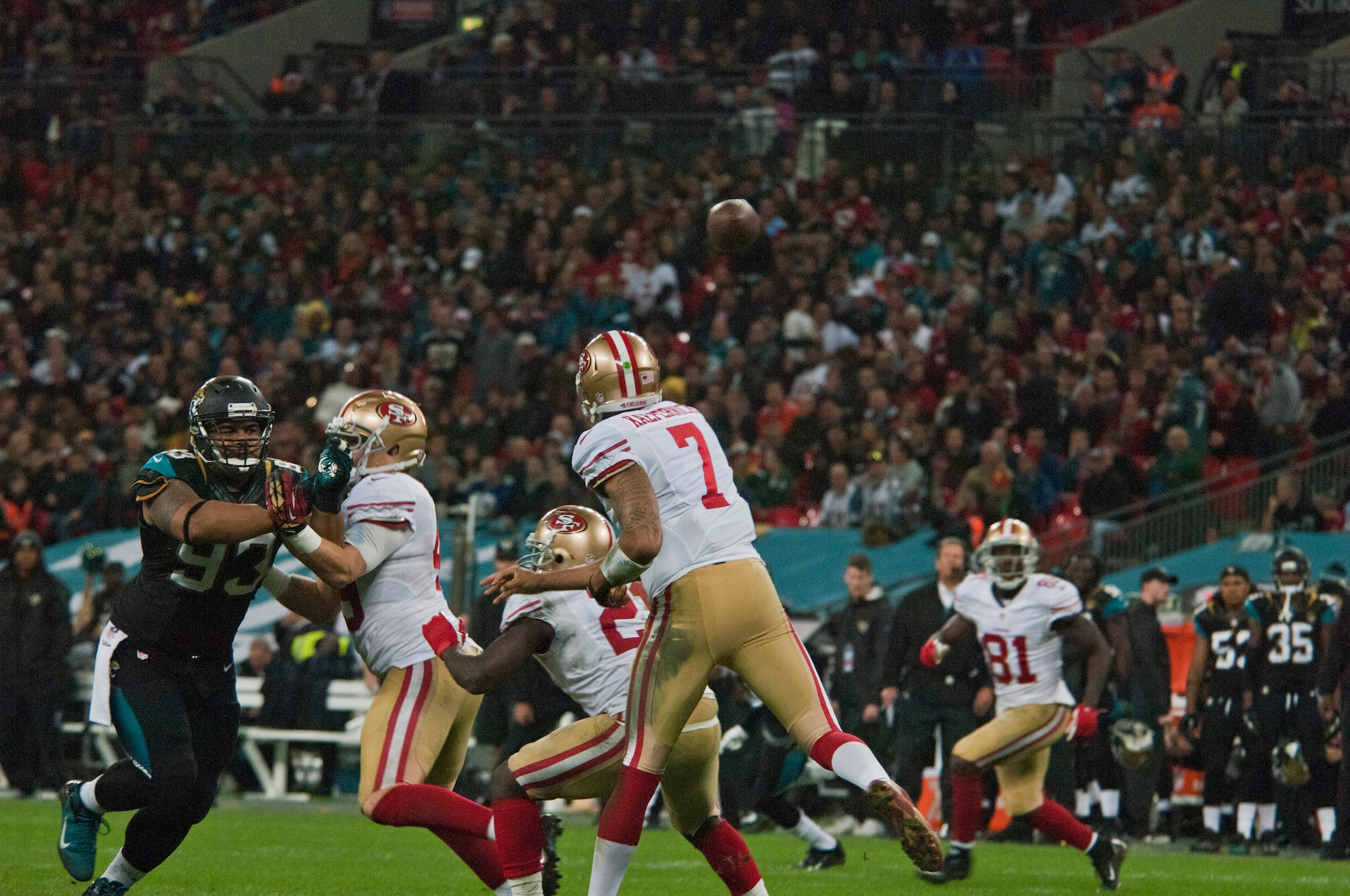 Colin Kaepernick, San Francisco 49ers quarterback, rockets a pass to wide receiver Anquan Boldin during the Oct. 27, 2013, NFL International Series game at Wembley Stadium, London. The 49ers played the Jacksonville Jaguars, routing them  42-10. Royal Air Force Lakenheath Airmen took part in the pregame ceremony, displaying large U.S. and U.K flags.  (U.S. Air Force photo by 2nd Lt. Keenan Kunst/Released)