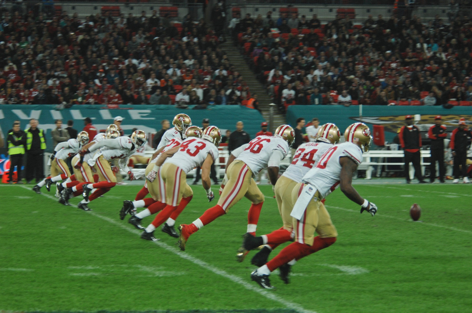 The San Francisco 49ers kick off after a touchdown, during their NFL International Series game against the Jacksonville Jaguars at Wembley Stadium, London, Oct. 27, 2013. American Airmen from Royal Air Force Lakenheath honored both the U.S. and U.K. by presenting giant versions of the nations’ flags during the pregame ceremony. (U.S. Air Force photo by 2nd Lt. Keenan Kunst/Released)
