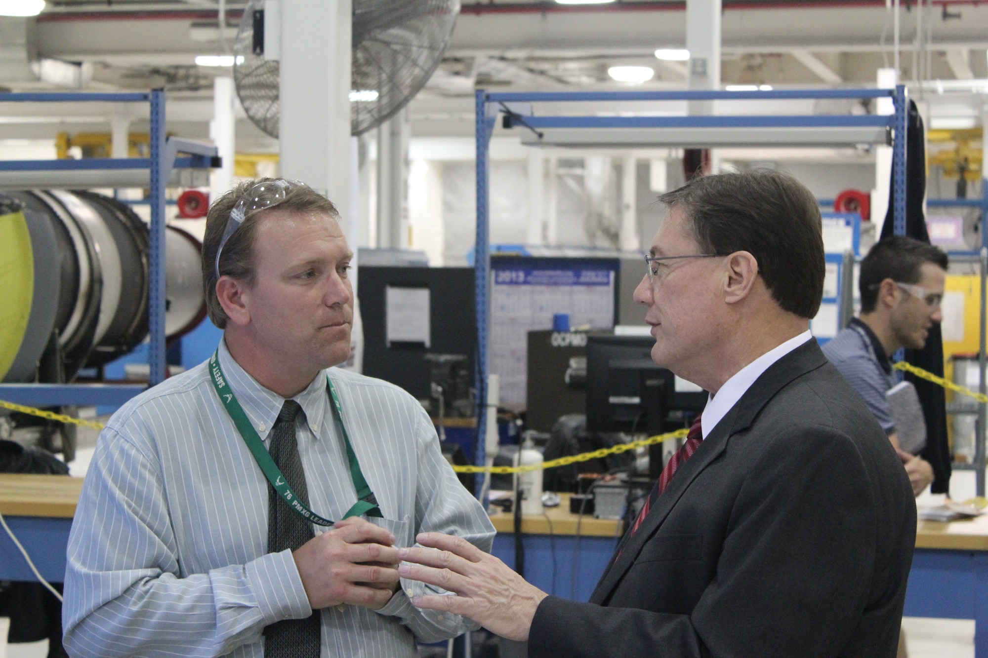 Chad Curl, 546th Propulsion Maintenanace Squadron, talks to Paul Peters, principal deputy assistant secretary of Defense, Logistics and Materiel Readiness, about the F108 Gated Process. During his Oct. 28 site visit to Tinker Air Force Base and Defense Logistics Agency Distribution, Oklahoma City, Mr. Peters was also briefed on Cost Effective Readiness and F108 Engine parts at the Oklahoma City Air Logistics Complex. (Air Force photo by Myron Knight)