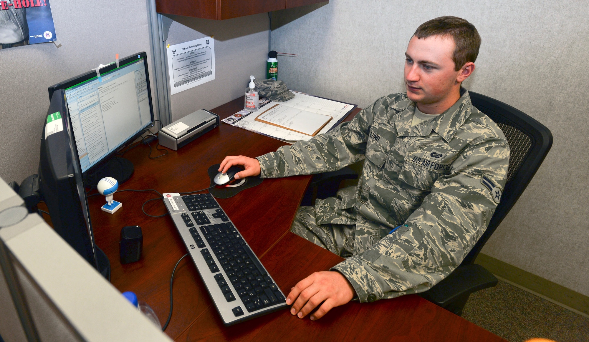 Airman 1st Class Russell Lund, 22nd Contracting Squadron contract apprentice technician, uses the Procurement Desktop Defense program to modify a contract Oct. 30, 2013, at McConnell Air Force Base, Kan. Lund works in several aspects of Air Force contracting including closing out contracts once the contractors work is completed. He was chosen as the 22nd Air Refueling Wing spotlight performer of the week, Oct. 28 to Nov. 1, 2013. (U. S. Air Force photo/Airman 1st Class Colby L. Hardin)