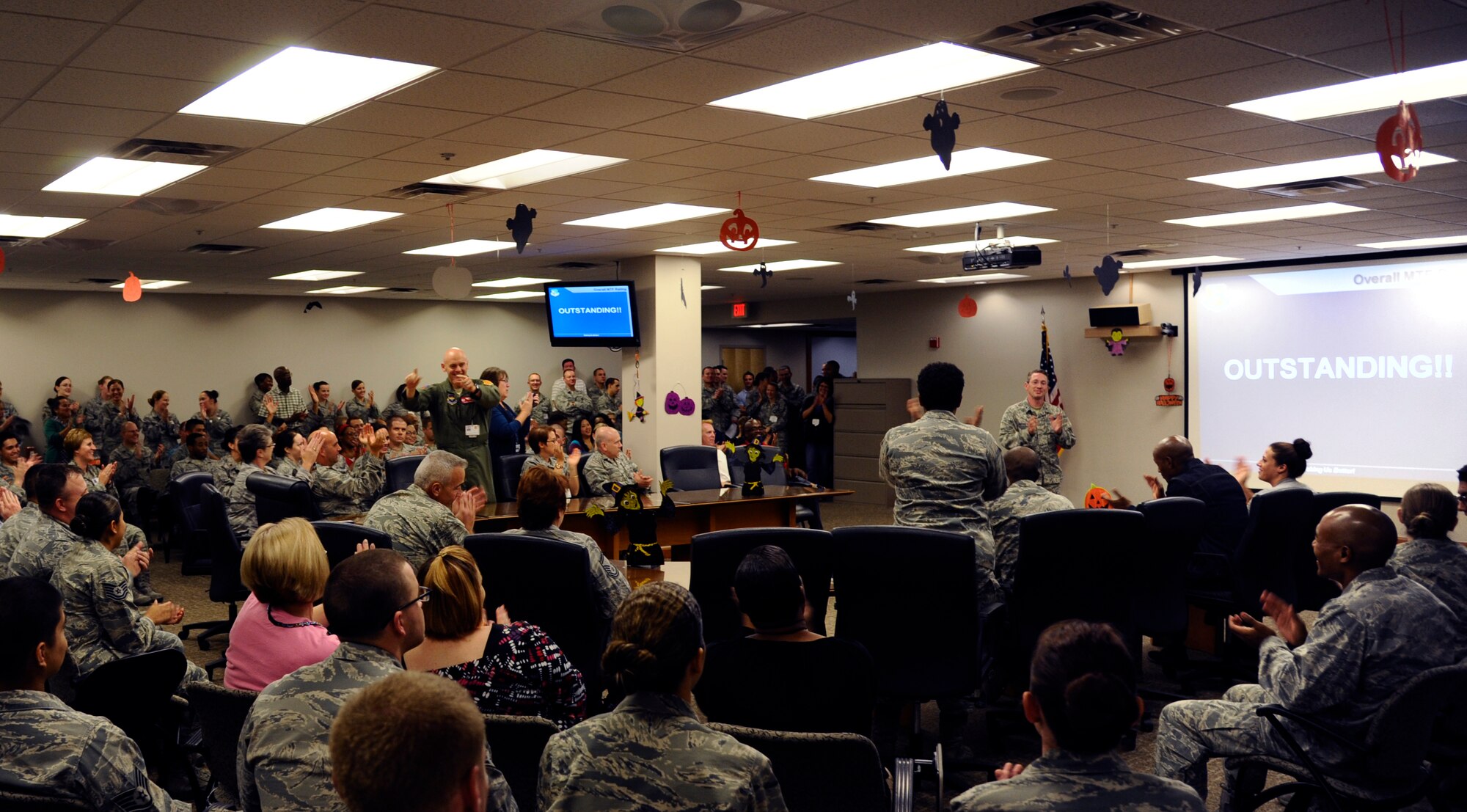 Brig. Gen. Mike Rothstein, 56th Fighter Wing commander, announces an “outstanding” score Oct. 25 for the 56th Medical Group’s Health Services Inspection. The score came with accolades from inspectors praising the customer service, care and process improvements in the MDG. (U.S. Air Force photo/Staff Sgt. C.J. Hatch)