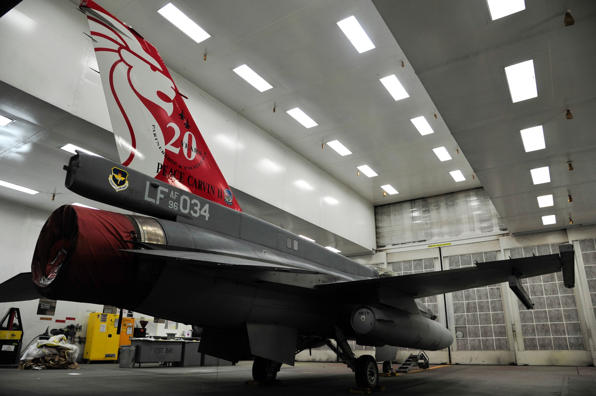 The Republic of Singapore’s F-16 fighter jet tail painting was completed Oct. 24 in the corrosion building paint booth on Luke Air Force Base. Personnel from the 56th Equipment Maintenance Squadron corrosion control section spent several days working on this one-of-a-kind project. (U.S. Air Force photo/Senior Airman Grace Lee)