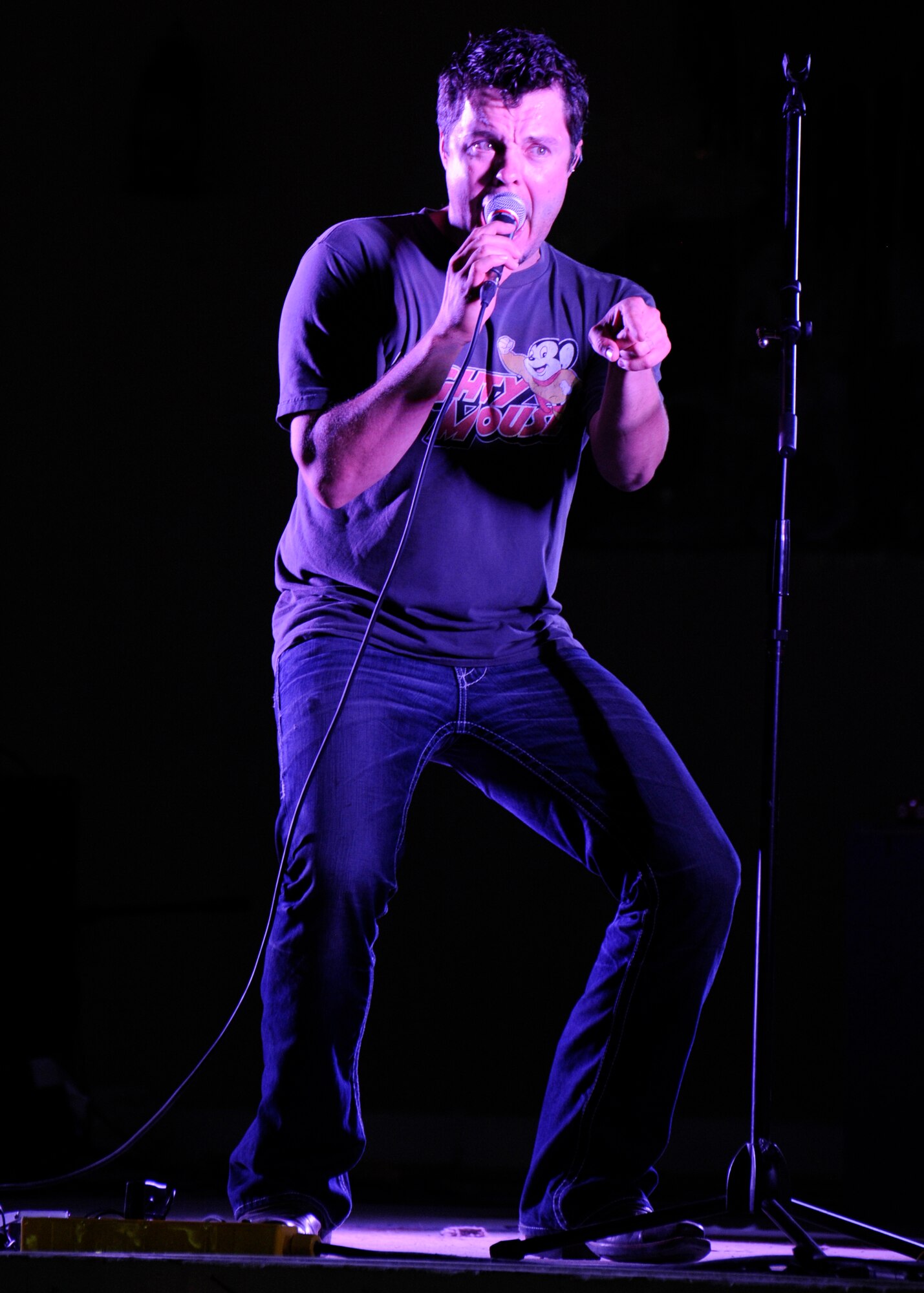 Jason Wyatt, the “Lost Trailers” lead vocalist, sings during a performance at the 379th Air Expeditionary Wing in Southwest Asia, Oct. 31, 2013. During the 379th Expeditionary Force Support Squadron hosted event, the American country band expressed their gratitude for military service members. (U.S. Air Force photo/Senior Airman Bahja J. Jones) 
