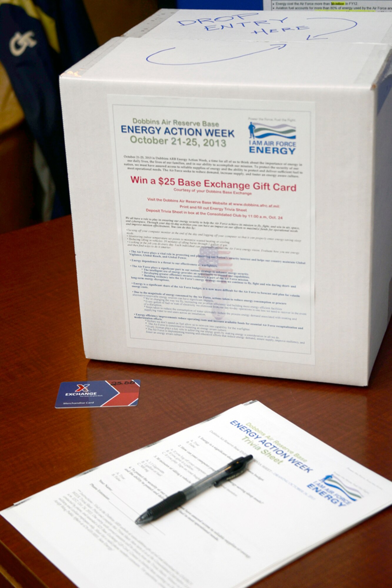 Members of Dobbins Air Reserve Base, Ga. participate in a drawing for a $25 Base Exchange Gift card by completing a short Energy Action Trivia Sheet, celebrating Air Force Energy Action Month, Oct. 24 at the base consolidated club. Dobbins Energy Action Week took place Oct. 21 thru 25, and consisted of awareness, trivia, prizes and members of base civil engineering offering members ways to save energy and resources in their home as well as work areas. (U.S. Air Force photo/Don Peek)