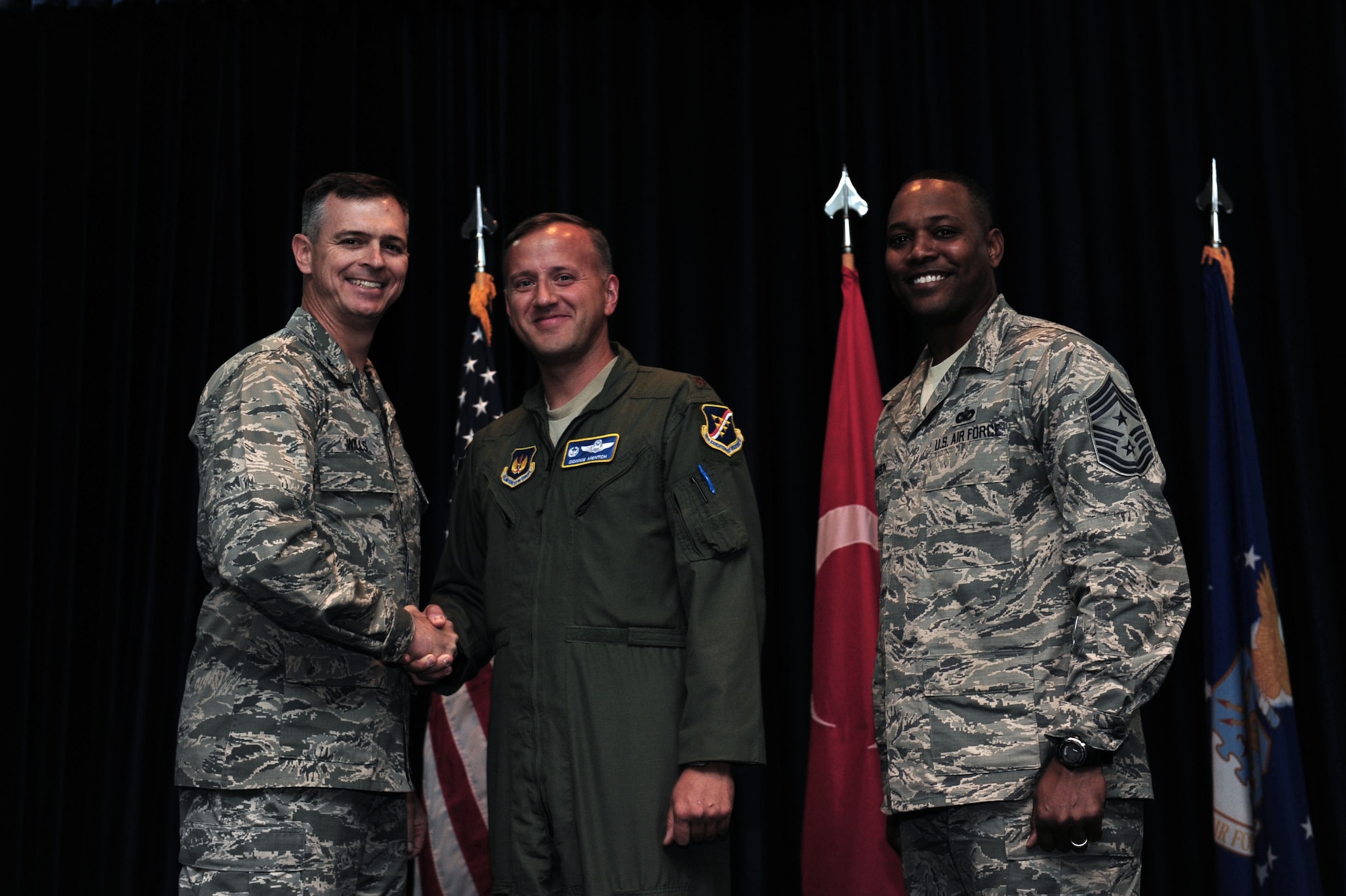 Maj. Donald Mentch, 414th Expeditionary Reconnaissance Squadron commander deployed from Creech Air Force Base, N.V., is awarded this week's "Pick of the 'Lik" Oct. 31, 2013, at Incirlik Air Base, Turkey.  Mentch provided his technical expertise and repaired 17 bird aversion strike hazard cannons and seven bowling alley lanes. (U.S. Air Force photo by Airman 1st Class Nicole Sikorski/Released) 
