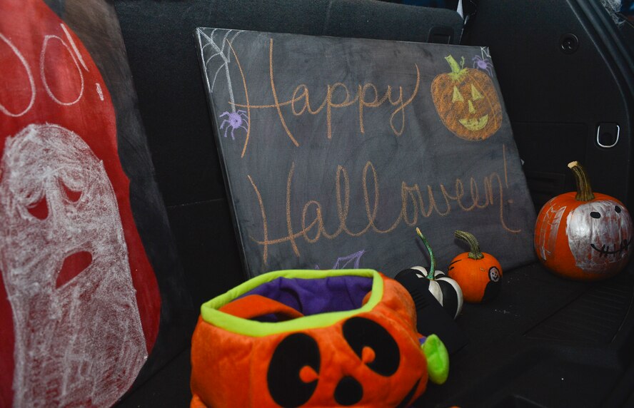 Trunks of cars were lined with Halloween decorations and candy along Donnley Park for the 2013 Halloween Trunk or Treat, Oct. 31, 2013, Ramstein Air Base, Germany. Trunk or Treat featured goblins, ghouls, monsters, minions, aliens, and dinosaurs, as well as food, games, movies, costume contests and trunks full of candy for eager trick-or-treaters. (U.S. Air Force photo/Airman 1st Class Jordan Castelan)