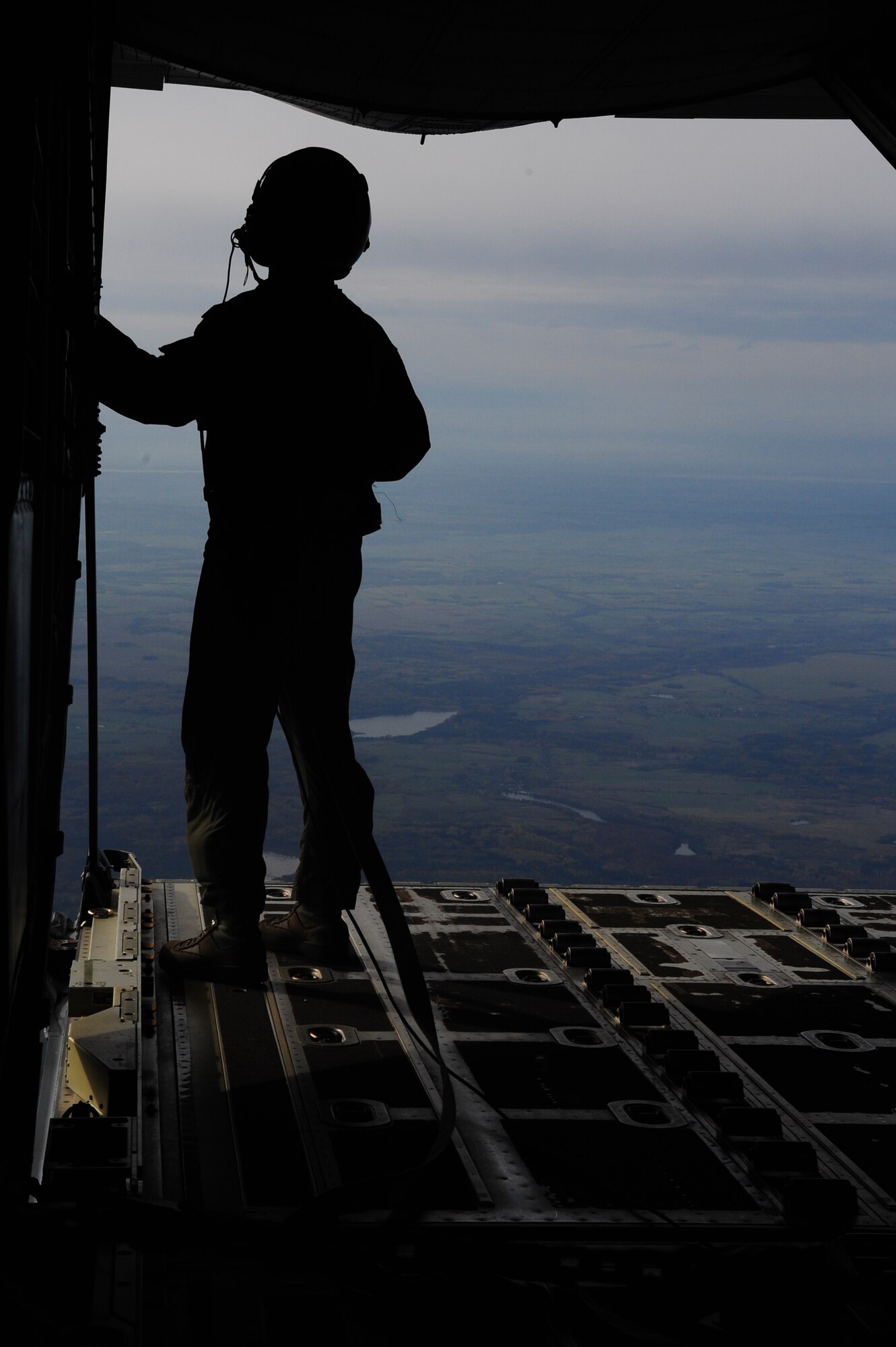 Master Sgt. Jason Beebe, 37th Airlift Squadron loadmaster, begins preparations in order to drop the Joint Precision Airdrop System to test the capabilities of the system before active employment, Oct. 23, 2013, Powidz Air Transport Base, Poland. The JPADS is equipped with a GPS, allowing the bundles to land within feet of the point of impact, ensuring they get to war fighters. (U.S. Air Force photo/Senior Airman Hailey Haux)