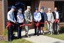 YOUNGSTOWN AIR RESERVE STATION, Ohio – Air Force Reserve Health Professional Recruiter Senior Master Sgt. John Wood, Enlisted Recruiter Master Sgt. Randi Baum, 910th Airlift Wing Commander Col. James Dignan, Recruiting Flight Chief Senior Master Sgt. Joann Shaw, Cleveland Heights Recruiter Master Sgt. Tiffany Grullon, 910th Mission Support Group Commander Col. Teresa Hams and YARS Chief Civil Engineer Bob Woods cut the ribbon to celebrate the opening of the new and state-of-the-art Recruiting Center here, Oct 28, 2013. For more information about a career in the Air Force Reserve, contact the Youngstown Air Reserve Station Recruiting Center at 330-609-1394. U.S. Air Force photo by Mr. Eric M. White