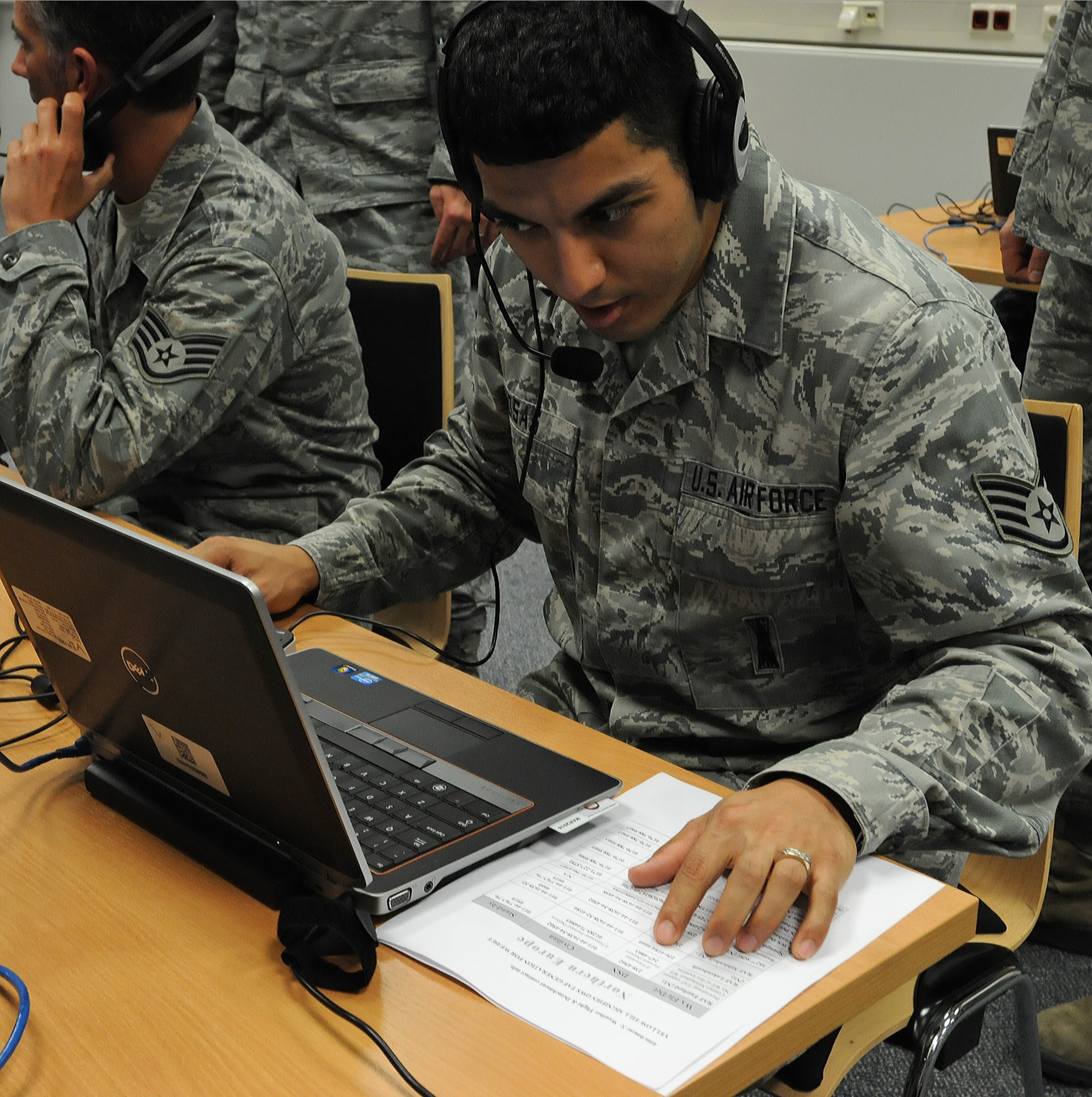 Staff Sgt. Ricky Rosas, 21st Operational Weather Squadron weather forecaster, calls mission partners to inform them of the location change after establishing operations at an alternate location during an evacuation exercise, Oct. 24, 2013, Kapaun Air Station, Germany. The 21st OWS conducts inspections every quarter to prepare operations at an alternate location if the primary location can’t be accessed. (U.S. Air Force photo/Airman 1st Class Holly Mansfield)