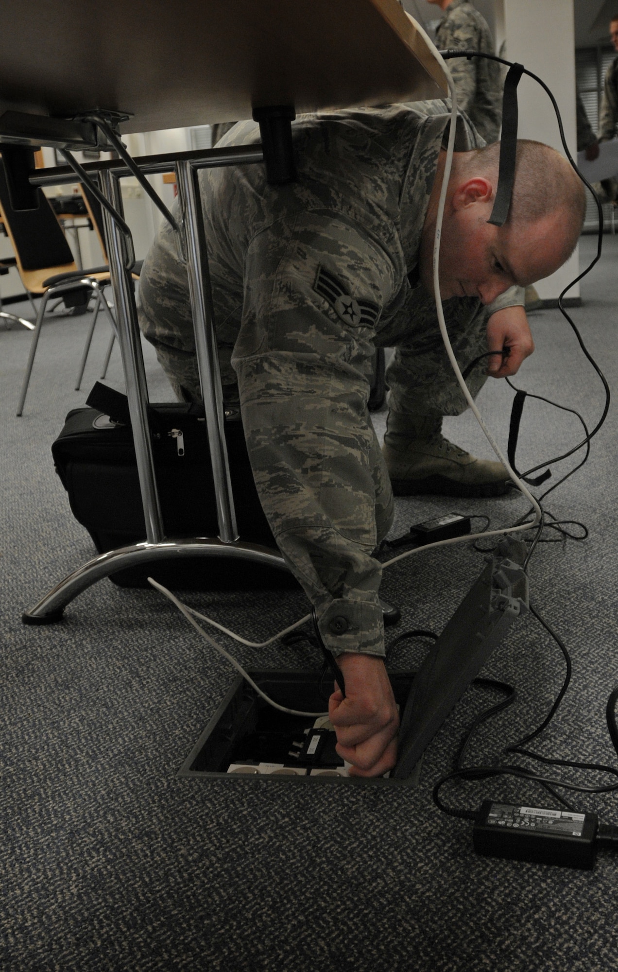 Senior Airman Phillip Bramley, 21st Operational Weather Squadron weather forecaster, sets up laptops to forecast the weather at an alternate location during an evacuation exercise, Oct. 24, 2013, Kapaun Air Station, Germany. The 21st OWS conducts inspections every quarter to prepare operations at an alternate location if the primary location can’t be accessed. (U.S. Air Force photo/Airman 1st Class Holly Mansfield)