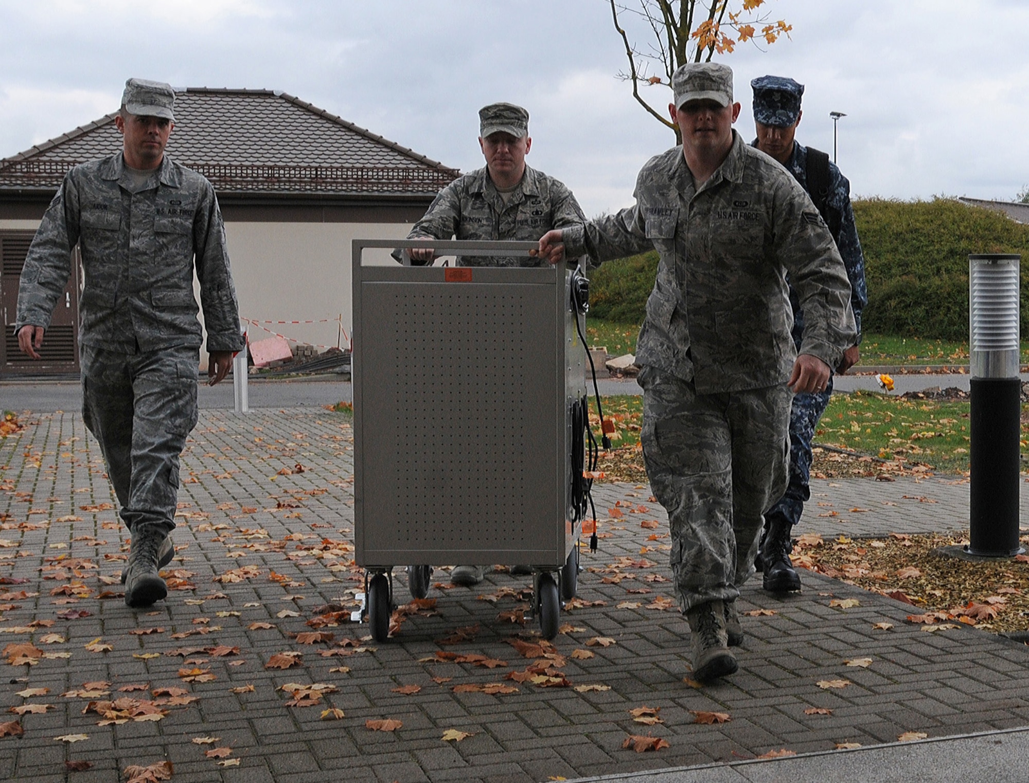 Members of the 21st Operational Weather Squadron move equipment to an alternate location during an evacuation exercise, Oct. 24, 2013, Kapaun Air Station, Germany. The 21st OWS conducts inspections every quarter to prepare operations at an alternate location if the primary location can’t be accessed. (U.S. Air Force photo/Airman 1st Class Holly Mansfield)