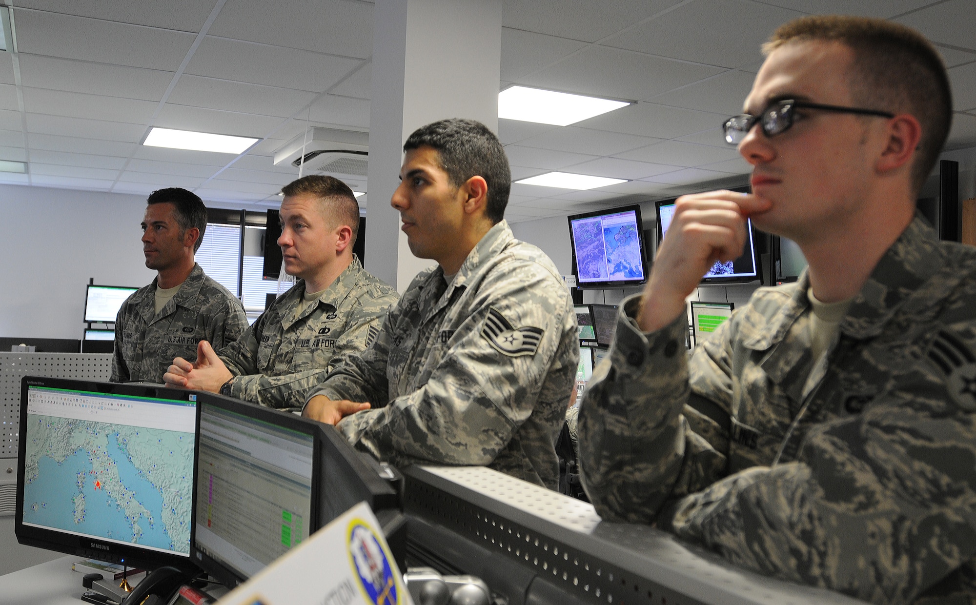 Members of the 21st Operational Weather Squadron review weather conditions in Europe and Africa before conducting an evacuation exercise, Oct. 24, 2013, Kapaun Air Station, Germany. The 21st OWS conducts inspections every quarter to prepare operations at an alternate location if the primary location can’t be accessed. (U.S. Air Force photo/Airman 1st Class Holly Mansfield)