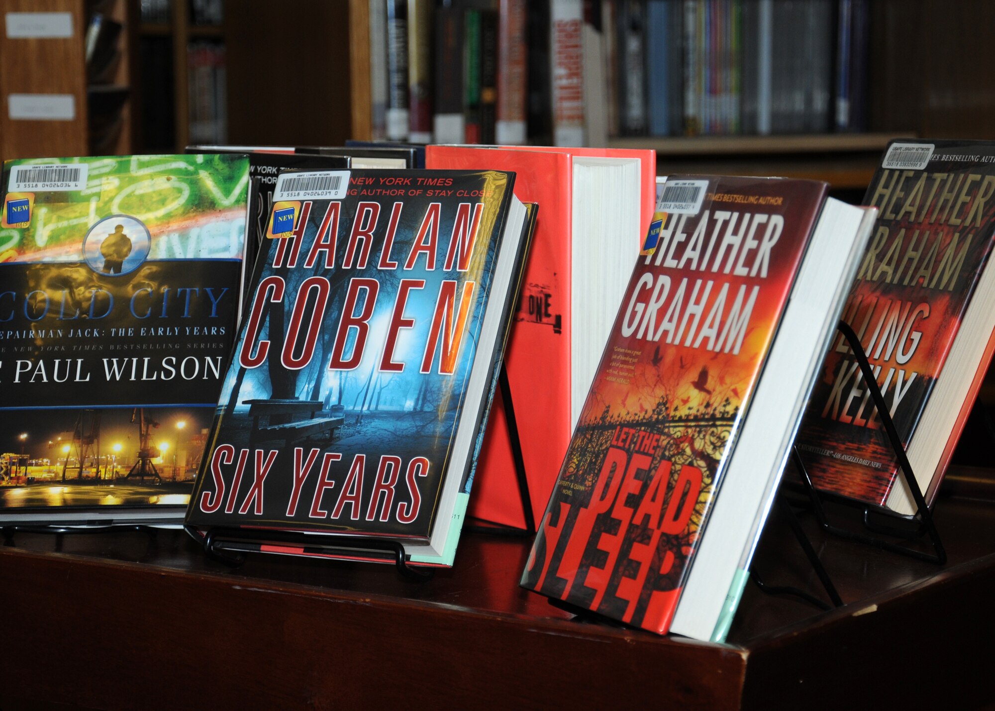 Books are displayed in preparation for a USO-sponsored tour, Operation Thriller IV, featuring authors Kathleen Antrim, Phillip Margolin, Harlan Coben, F. Paul Wilson and Heather Graham Oct. 31, 2013, at the library on RAF Mildenhall, England. The tour also visited the U.S., Kuwait and Germany. Following the book-signing, some of the authors returned to the U.S., while others continued on to Brighton, England, for a fantasy writers’ convention. (U.S. Air Force photo by Gina Randall/Released) 