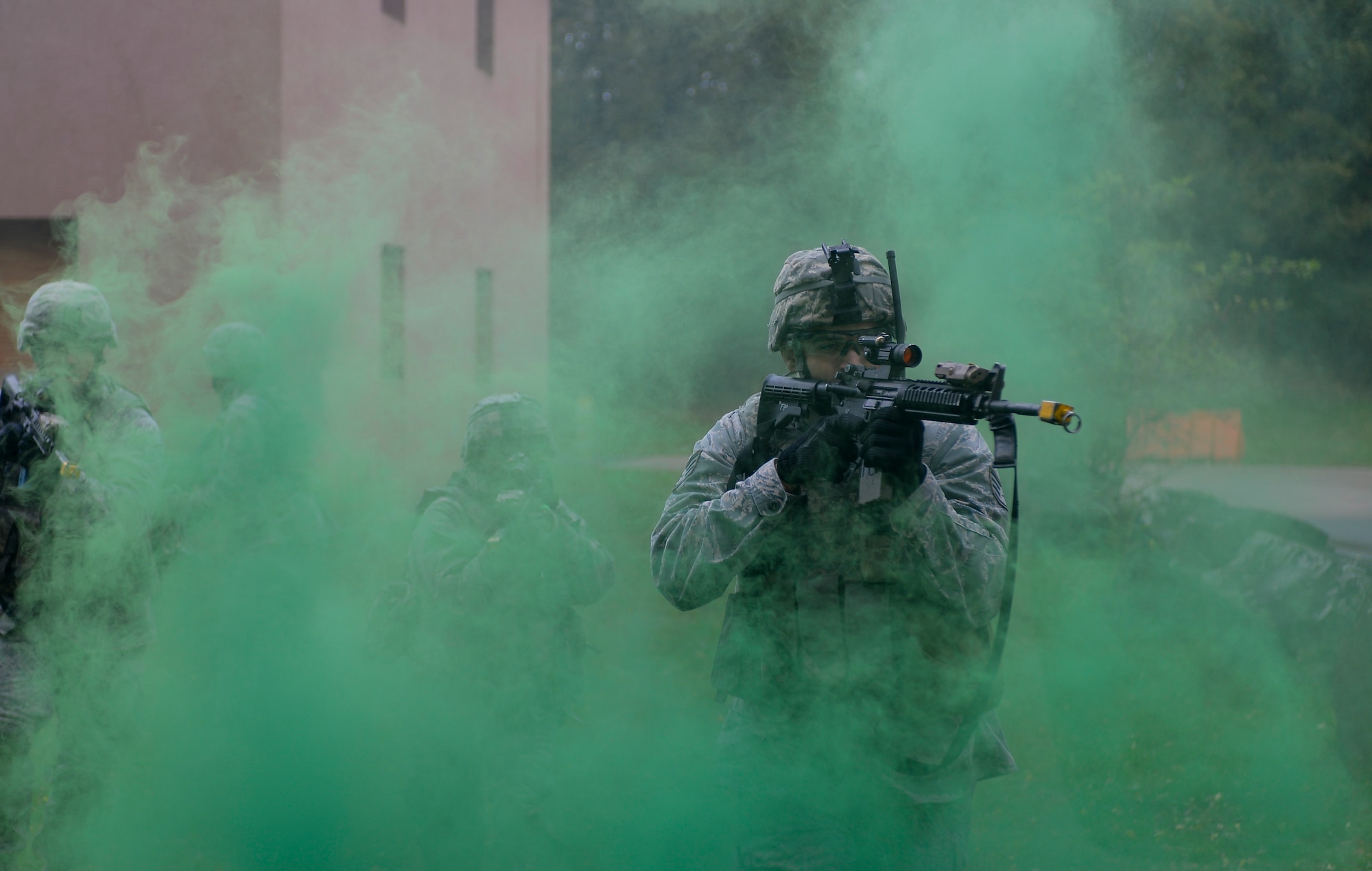 Staff Sgt. Jon-Paul Horning, 86th Security Forces Squadron creek defender course trainee, advances through a smoke grenade during building clearance training, Oct. 17, 2013, Baumholder, Germany. Horning was part of a 98-student class undergoing training to prepare them for deployed conditions around the world. (U.S. Air Force photo/Airman 1st Class Jordan Castelan)