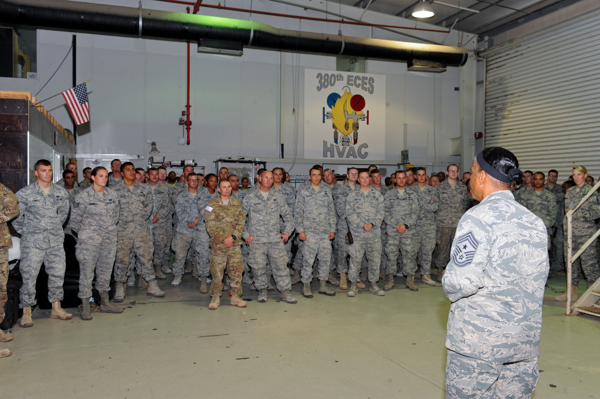U.S. Air Force Chief Master Sgt. Shelina Frey, United States Air Forces Central Command command chief master sergeant, speaks to Airmen from the 380th Expeditionary Civil Engineer Squadron, at an undisclosed location in Southwest Asia, Oct. 23, 2013. Frey spoke to the engineers about protecting and taking care of fellow Airmen. Frey said it is important that Airmen take care of each other, and it starts with respecting oneself. (U.S. Air Force photo by Staff Sgt. Joshua J. Garcia) 