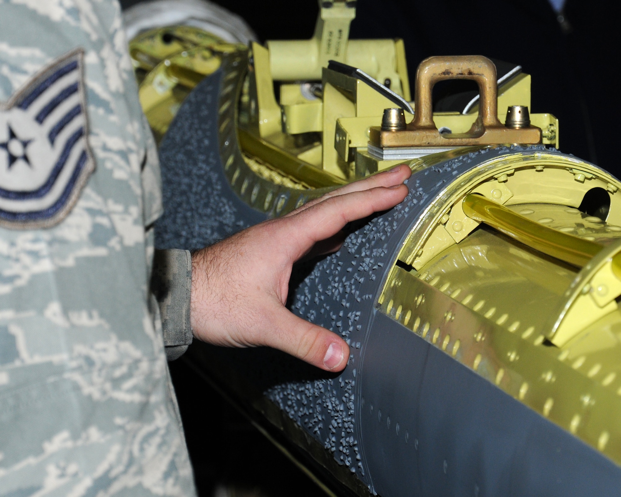 U.S. Air Force Tech. Sgt. Scott Eidson, 100th Maintenance Squadron continuous improvement manager from Odessa, Texas, discusses opportunities to streamline processes and create synergy between the 100th Logistics Readiness Squadron and the 100th MXS Oct. 30, 2013, on RAF Mildenhall, England. Members of RAF Marham were invited as a partnership-building effort to share their quality and continuous improvement team’s experiences and to benchmark good maintenance practices. Eidson showed the RAF members the maintenance process areas that need attention. (U.S. Air Force photo by Gina Randall/Released) 