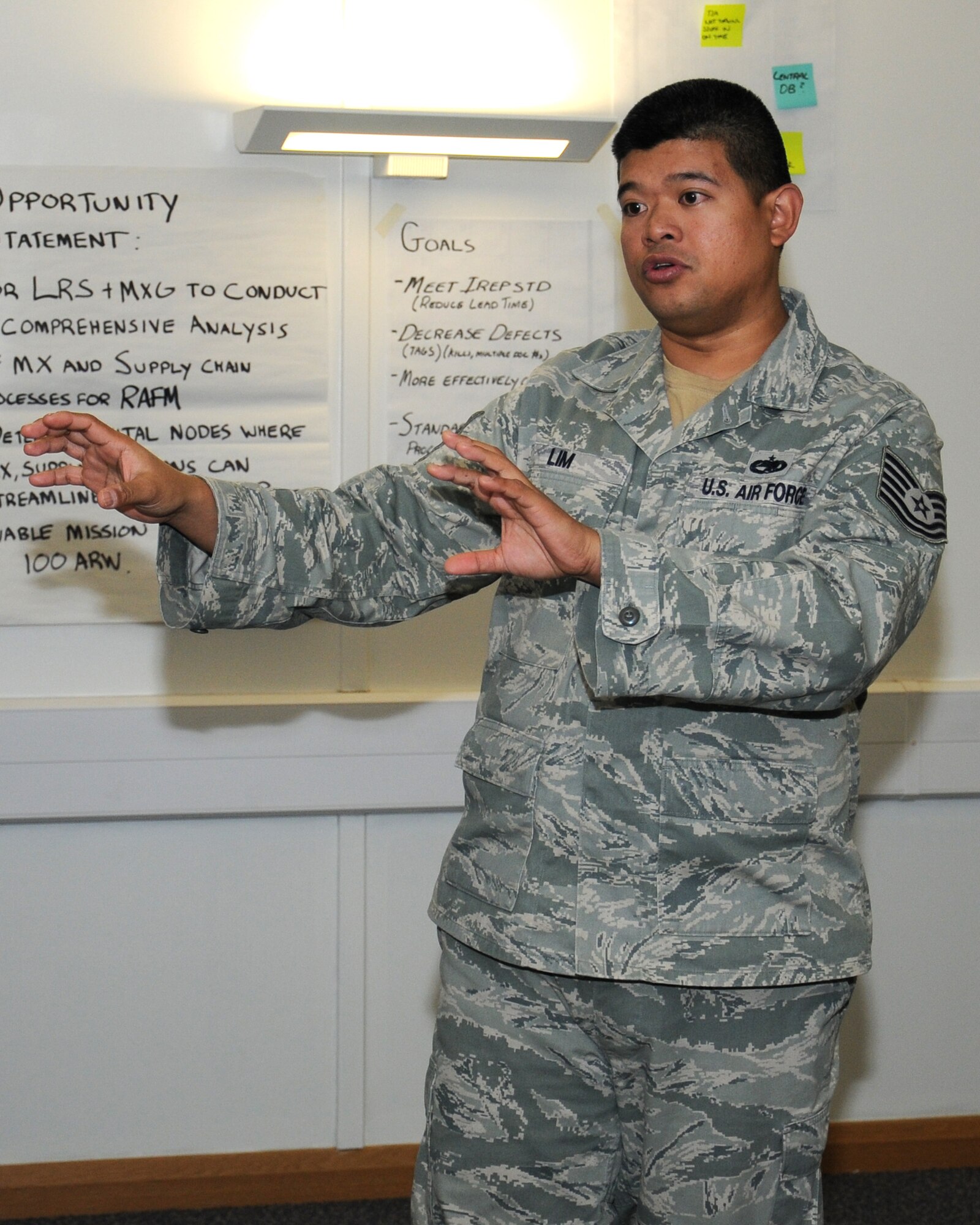 U.S. Air Force Tech. Sgt. Michael Sibala-Lim, 100th Maintenance Squadron inspection section chief from Lutz, Fla., discusses opportunities to streamline processes and create synergy between the 100th Logistics Readiness Squadron and the 100th MXS Oct. 30, 2013, on RAF Mildenhall, England. Members of RAF Marham were invited as a partnership-building effort to share their team’s experiences and quality and continuous improvement to benchmark good maintenance practices. (U.S. Air Force photo by Gina Randall/Released) 