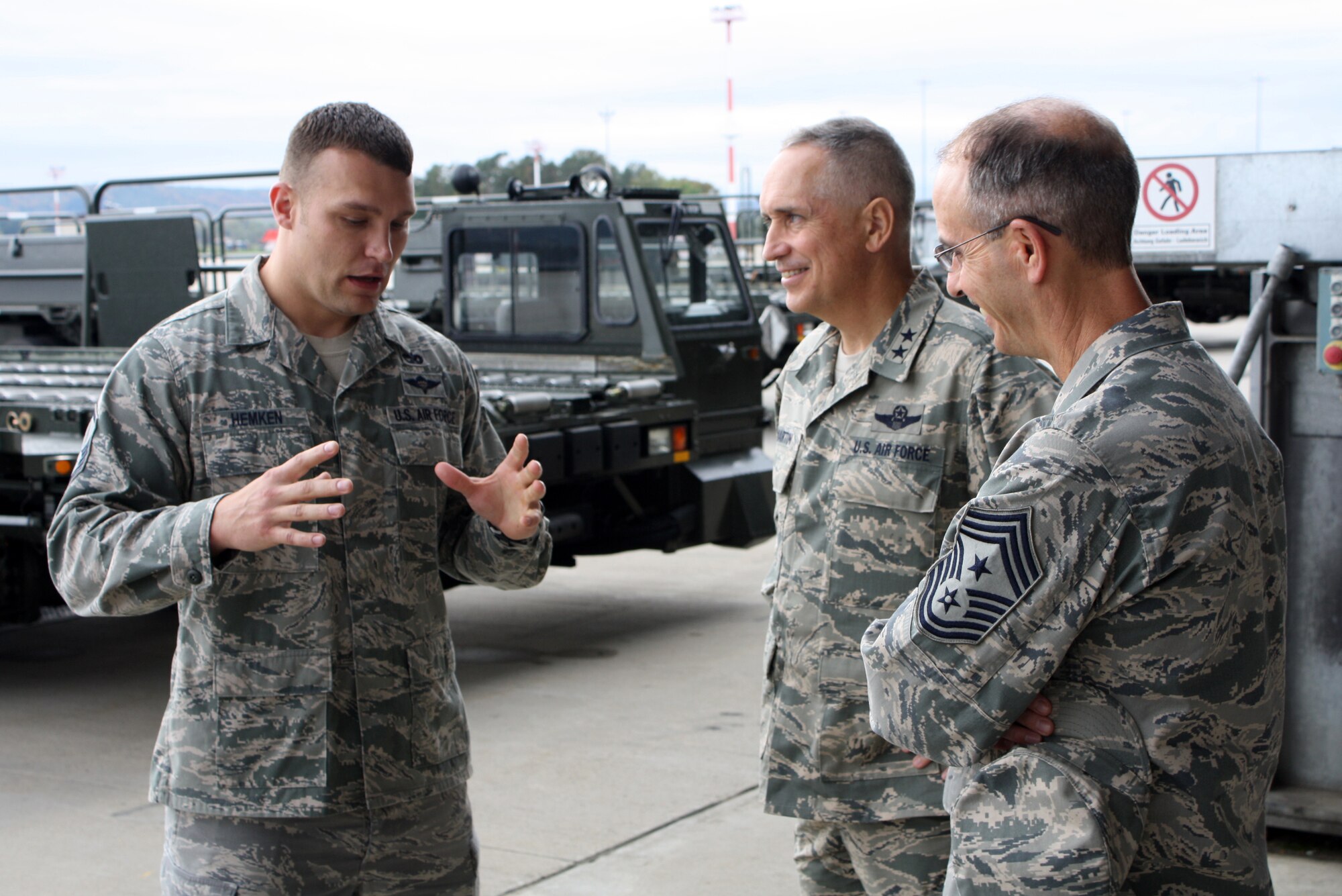 Maj. Gen. Frederick H. “Rick” Martin (left), U.S. Air Force Expeditionary Center commander, and Expeditionary Center Command Chief Master Sgt. Pete Stone (center),  discuss the aerial port operations with Master Sgt. Justin Hemken, 721st Aerial Port Squadron NCO in charge of ramp services. The 721st APS provides passenger services for the 521st Air Mobility Operations Wing to expedite warfighting and humanitarian missions throughout Europe, the Middle East and Africa. The Expeditionary Center provides direct oversight for the 521st AMOW and plans long- and short-term mission for global mobility. (U.S. Air Force photo/1st Lt. Nicole Mancos)