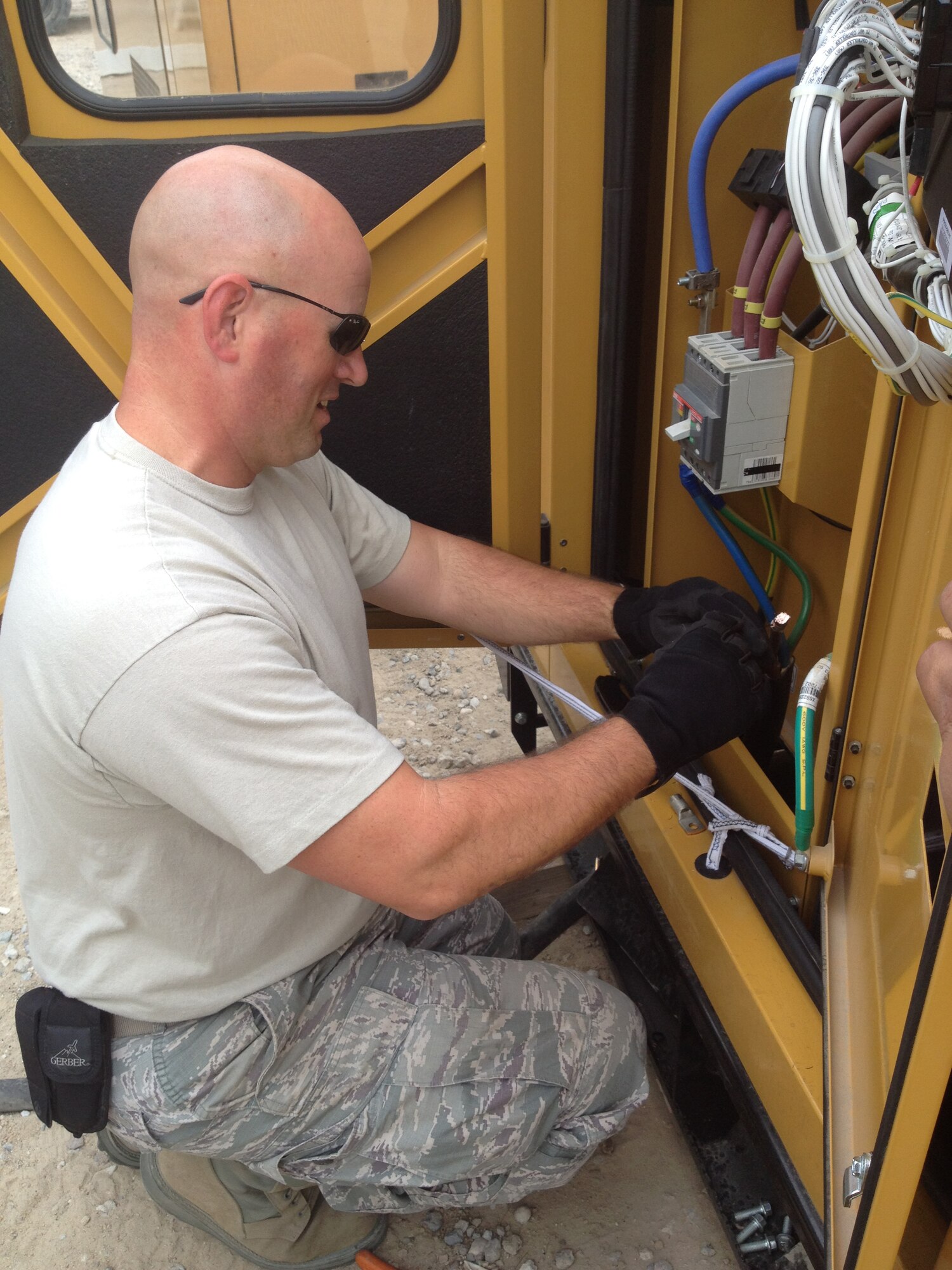 Tech. Sgt. Kelsey Kent installs a new generator at the security forces K9 area on his base.  Kent is deployed to the 387th Expeditionary Support Squadron civil engineer flight where he is the technical expert for the generator and light cart contract.  He has been selected by his leadership as this week’s Rock Solid Warrior.  The Homedale, Idaho, native is deployed from the 647th Civil Engineer Squadron, Joint Base Pearl Harbor-Hickam, Hawaii. (Courtesy photo)