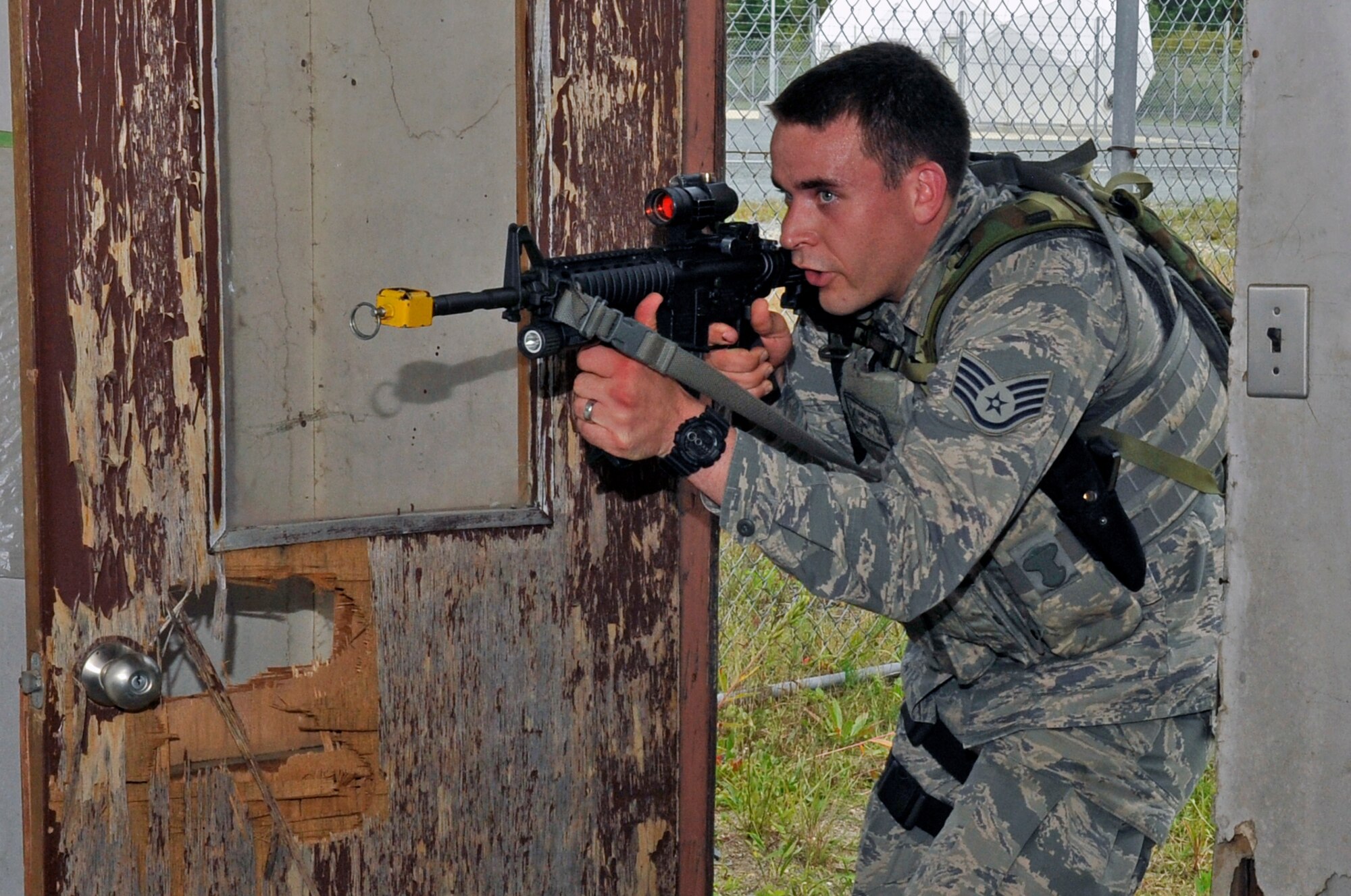 U.S. Air Force Staff Sgt. James Greuel, 35th Security Forces Squadron special reaction team member, clears a room during 35 SFS SRT tryouts at Misawa Air Base, Japan, Sept. 25, 2013. SRT members receive specialized training to handle high-risk situations that the base may encounter at any given time. (U.S. Air Force photo by Airman 1st Class Zachary Kee) 