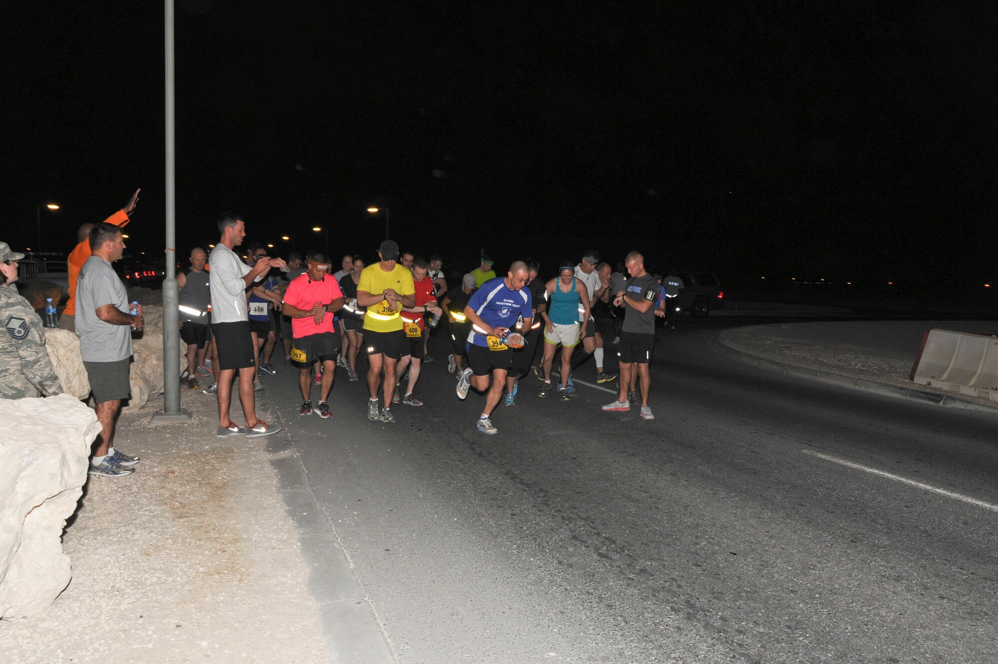 U.S. military marathon participants takeoff at the start of the Special Operations Command Central Forward Marine Corps Marathon at the 379th Air Expeditionary Wing in Southwest Asia, Oct. 27, 2013. The 26.2-mile run mirrored the 38th MCM held each year in Washington D.C. (U.S. Air Force photo/Tech. Sgt. Joselito Aribuabo)
