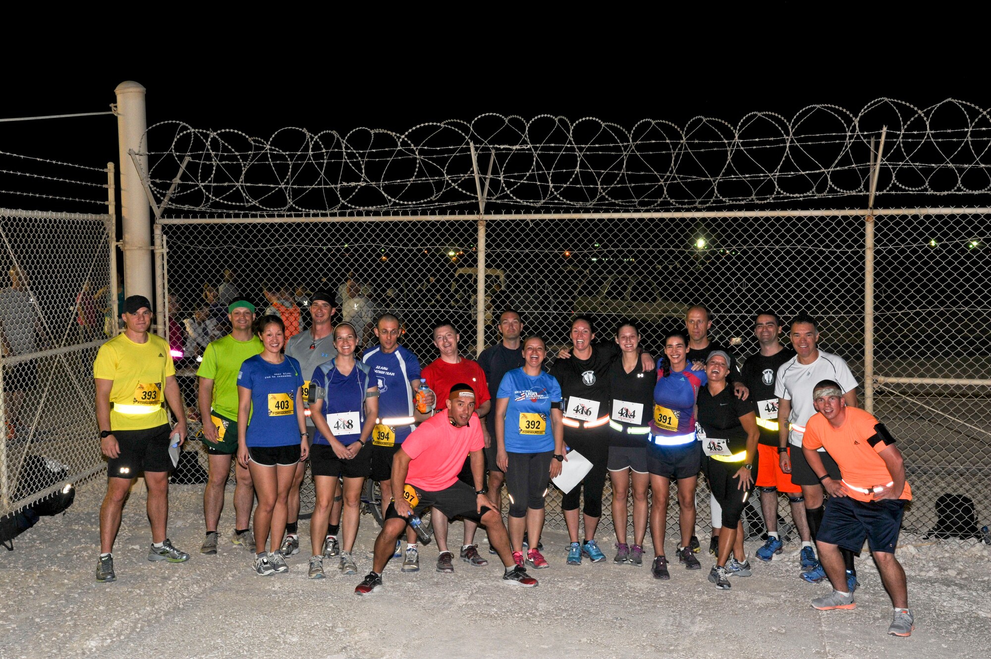 U.S. military service participated in the Special Operations Command Central Forward Marine Corps Marathon pose for a group photo at the 379th Air Expeditionary Wing in Southwest Asia, Oct. 27, 2013.  The 26.2-mile run mirrored the 38th MCM held each year in Washington, D.C. (U.S. Air Force photo/Tech. Sgt. Joselito Aribuabo)