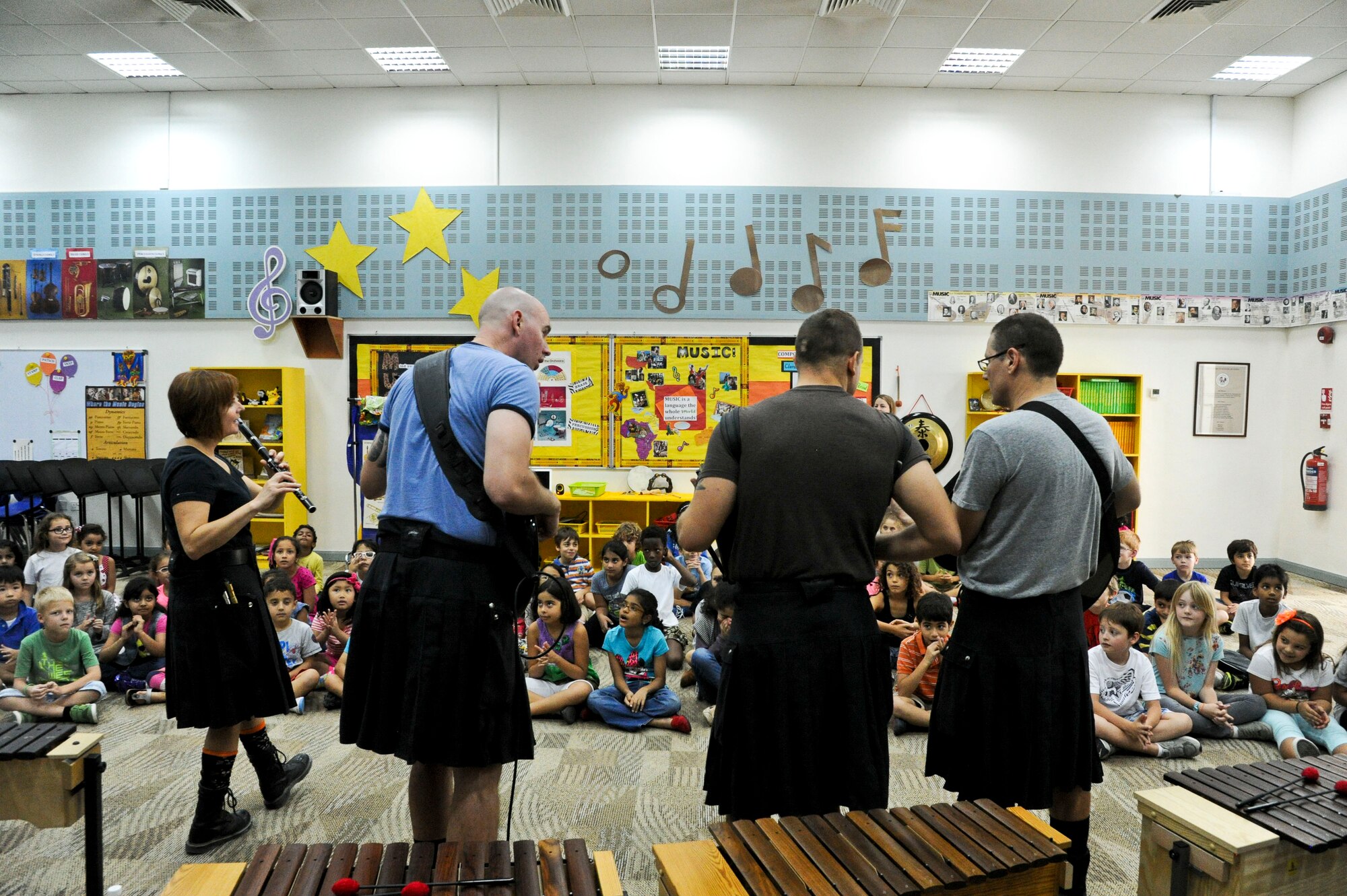 U.S. Air Forces Central Band the “Blue Yonders,” performs at a local school in Southwest Asia, Oct. 28, 2013.  The AFCENT band’s mission is to positively promote troop morale, diplomacy and outreach to host nation communities. (U.S. Air Force photo/Tech. Sgt. Joselito Aribuabo)