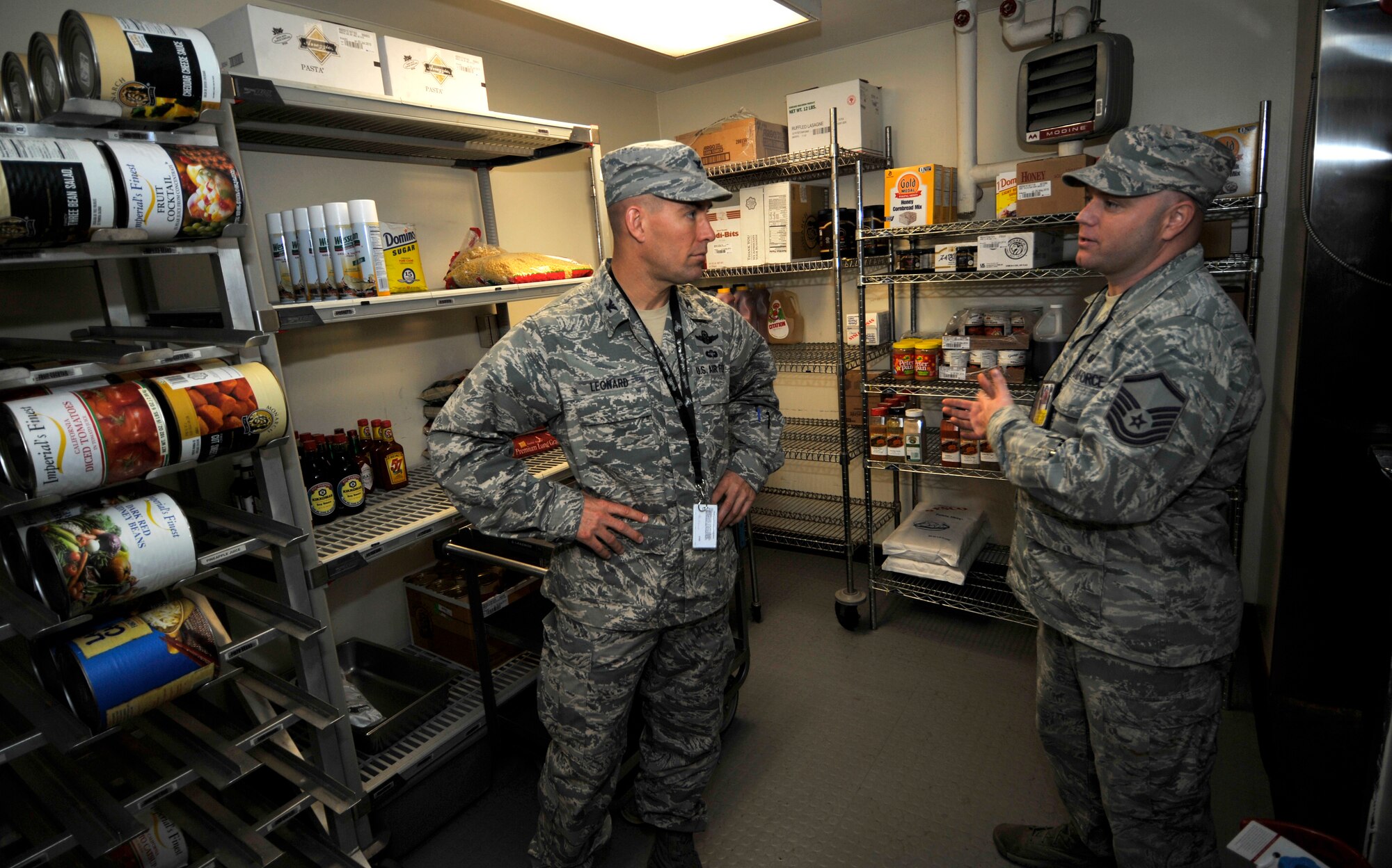 Master Sgt. Kenneth Lynn, 51st Force Support Squadron dining facility manager, gives Col. Brook Leonard, 51st Fighter Wing commander, a tour of the Back of the Hanger dining facility at Osan Air Base, Republic of Korea, Oct. 31, 2013. Leonard and Chief Master Sgt. Brendan Criswell, 51st FW command chief, made the visit to witness first-hand the impact the facility has on the flight line’s daily mission. (U.S. Air Force photo/Staff Sgt. Emerson Nuñez)