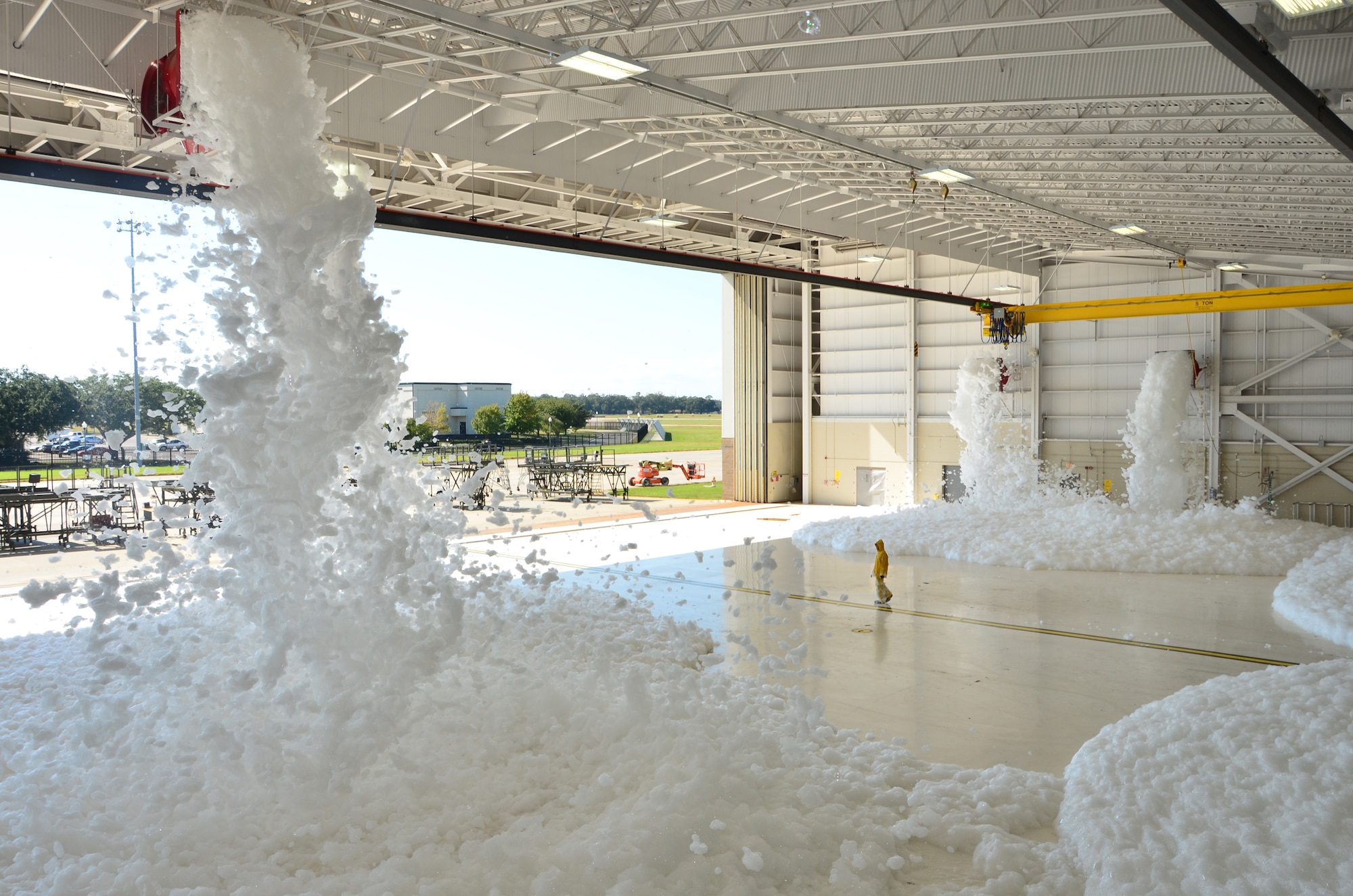 Keesler Air Force Base personnel conduct a foam-dump test of the 403rd Isochronal-inspection Dock's fire suppression system Oct. 28. This test is performed every two years to ensure the proper function of system's ability to squelch a potentially catastophic fire event. An ISO-Dock is a hanger that is designed to reduce aircraft inspection costs by allowing on-site inspections from several maintenace departments at the same time.
