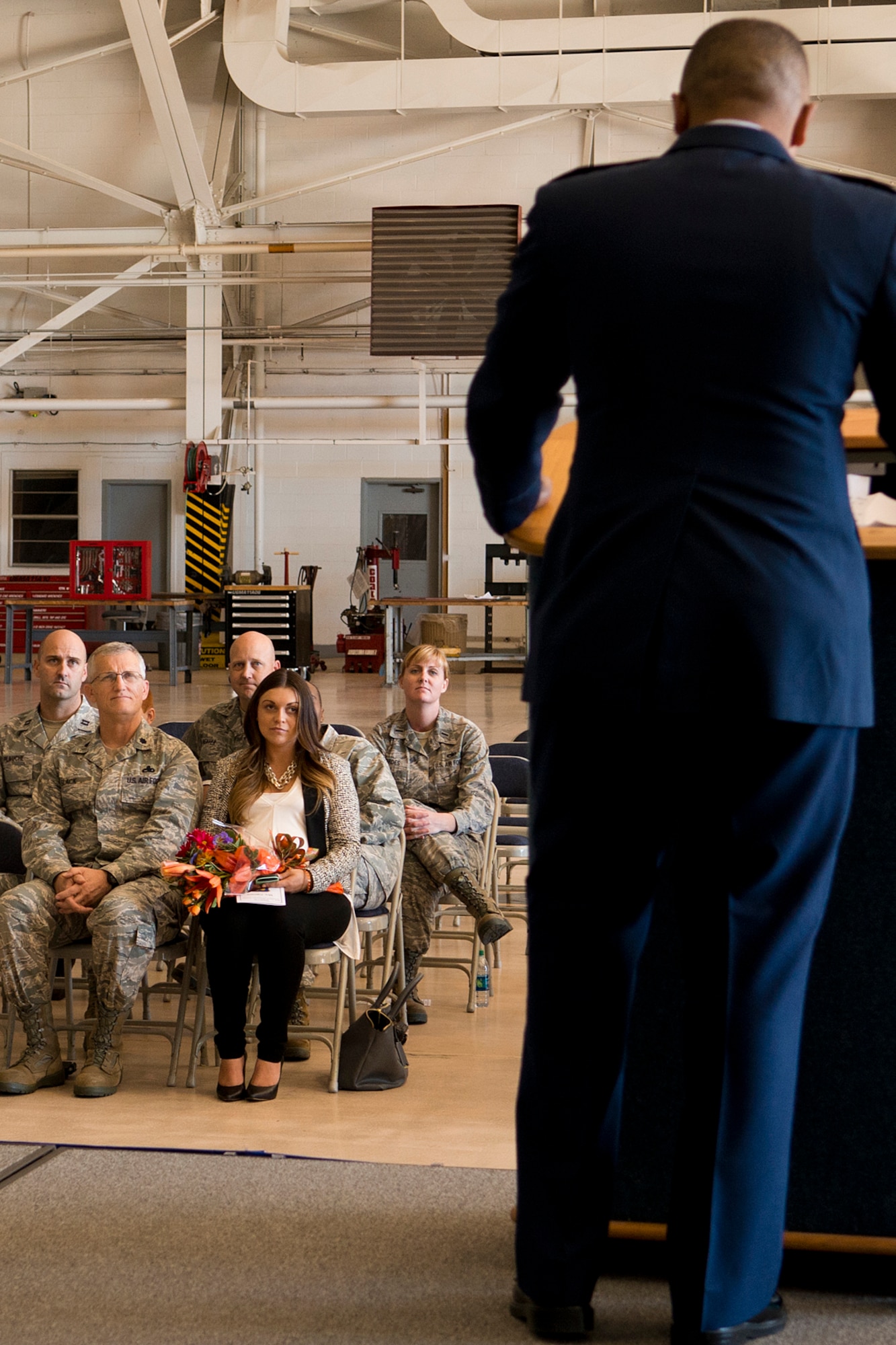 Gabriela Cabrera watches as her husband speaks after assuming command of the 307th Aircraft Maintenance Squadron (AMXS) on Nov. 2, 2013, Barksdale Air Force Base, La. U.S. Air Force Maj. Steven Cabrera is the former Operations Officer assigned to the 926th AMXS at Nellis AFB, Nev. (U.S. Air Force photo by Master Sgt. Greg Steele/Released)