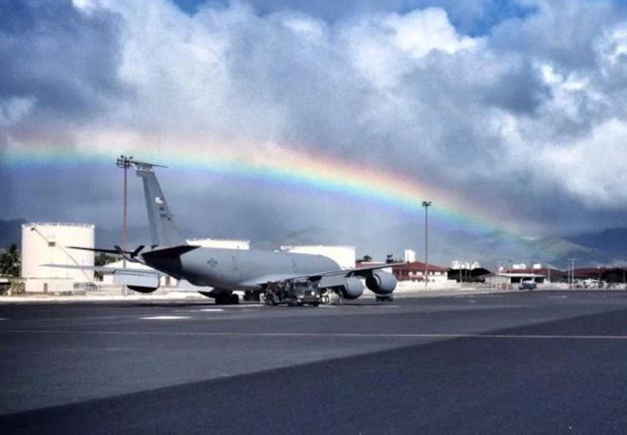 A KC-135 Stratotanker is serviced under a rainbow on the flightline of Hickam AFB, Hawaii, Nov. 2. The aircraft is flown and maintained by the 18th Air Refueling Squadron and the 931st Aircraft Maintenance Squadron from McConnell Air Force Base, Kan. Both are subsidiary units of the 931st Air Refueling Group. The 931st ARG Airmen are in Hawaii supporting refueling missions. (Air Force photo courtesy Lt. Col. Tsuyoshi Tung) 