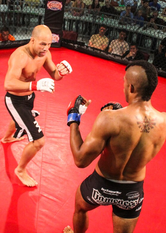 Danny Ruiz looks for a way to attack Ryan Hodge in their bout at Strike Fight II Sept. 21 at Eglin Air Force Base, Fla. Ruiz won by knockout in the first round. Ruiz is an Air Force reservist with the 919th Special Operations Logistics Readiness Squadron at Duke Field Fla. This was Eglin’s second mixed martial arts event. (Courtesy photo)