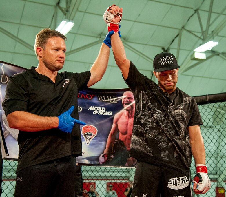 Danny Ruiz is declared the winner of his bout at Strike Fight II Sept. 21 at Eglin Air Force Base, Fla. Ruiz won by knockout in the first round. Ruiz is an Air Force reservist with the 919th Special Operations Logistics Readiness Squadron at Duke Field Fla. This was Eglin’s second mixed martial arts event and Ruiz's second straight victory. (U.S. Air Force photo/Tech. Sgt. Sam King)
