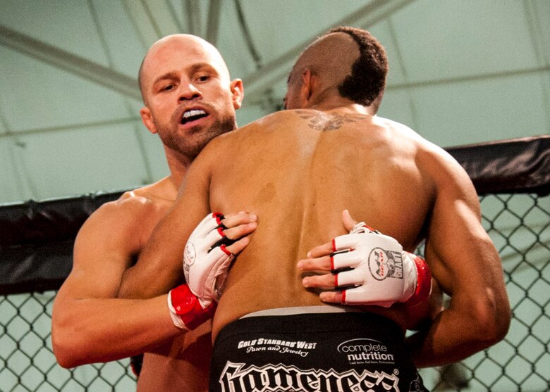 Danny Ruiz looks for a way to attack Ryan Hodge in their bout at Strike Fight II Sept. 21 at Eglin Air Force Base, Fla. Ruiz won by knockout in the first round. Ruiz is an Air Force reservist with the 919th Special Operations Logistics Readiness Squadron at Duke Field Fla. This was Eglin’s second mixed martial arts event and Ruiz's second straight victory. (U.S. Air Force photo/Tech. Sgt. Sam King)