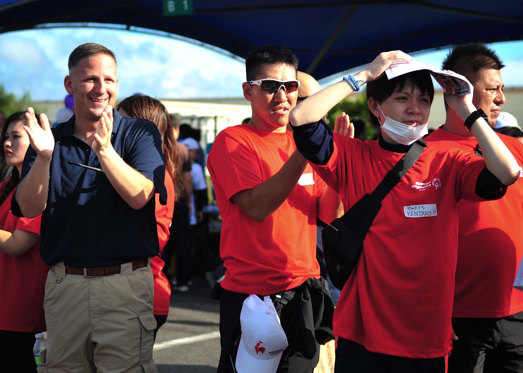 U.S. Air Force Senior Master Sgt. Robert Miller, 909th Aircraft Maintenance Unit superintendant, cheers special-needs athletes during the 14th annual Kadena Special Olympics on Kadena Air Base, Japan, Nov. 2, 2013. The event is sponsored by the 18th Wings and the Friends of Kadena Special Olympics in partnership with the Okinawa Prefectural Government, Okinawa City, Kadena Town, Chatan Town and all U.S. military services on island. The Friends of Kadena Special Olympics is a chartered private organization of military and civilian volunteers dedicated to enriching the lives of special-needs individuals through this sporting and cultural event. (U.S. Air Force photo by Staff Sgt. Amber E. N. Jacobs)