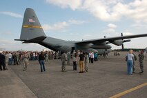 Airmen of the 103rd Airlift Wing along with family and distinguished visitors explore the first out of eight C-130H aircraft expected to be assigned to the Connecticut Air National Guard unit following a formal roll-out ceremony at Bradley Air National Guard Base, East Granby, Conn., Oct. 5, 2013. (U.S. Air National Guard photo by Tech. Sgt. Amy A. Robison)
