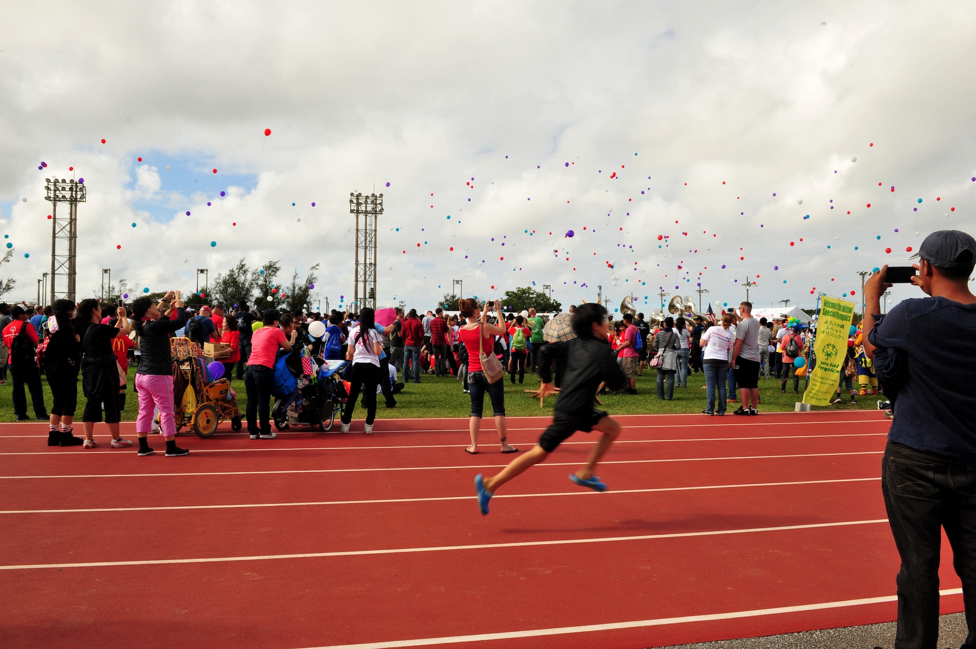 Balloons are released during the opening ceremony of the Kadena Special Olympics at Kadena Air Base, Japan, Nov. 2, 2013. Kadena Special Olympics began in 2000 with approximately 400 athletes and 600 volunteers as an 18th Wing community goodwill initiative to strengthen U.S. - Okinawa relationships. After 14 years, the event has more than doubled in size and participation. (U.S. Air Force photo by Staff Sgt. Rachelle Coleman)