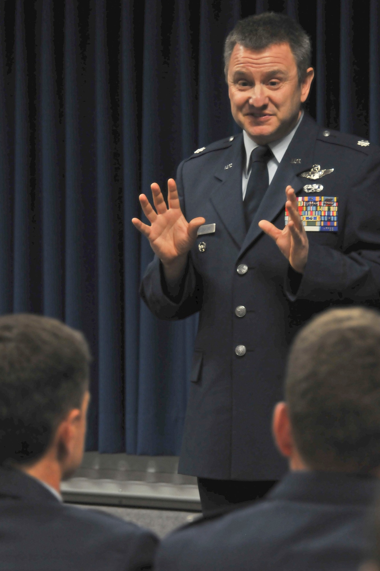 JOINT BASE ELMENDORF-RICHARDSON, Alaska -- Lt. Col. Michael Griesbaum, deputy commander of the 176 Operations Group, speaks to incoming and outgoing commanders of the 210th Rescue Squadron here Nov. 3, 2013. Lt. Col. Steven Latham took command of the squadron from Lt. Col. Thomas Bolin at a change-of-command ceremony. National Guard photo by Staff Sgt. N. Alicia Halla/ Released.