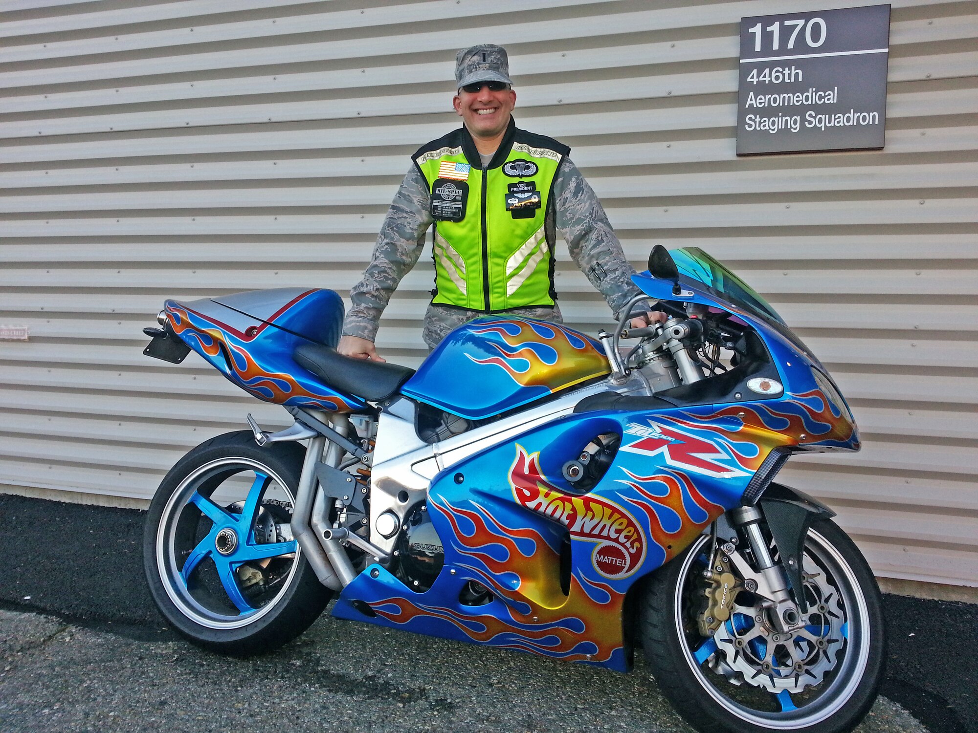 1st Lt. Paul Hall, Medical Readiness Deputy Flight Commander at the 446th Aeromedical Staging Squadron, stands with his 2000 Suzuki TL1000R outside of the 446th ASTS building on McChord Field. Hall is in a motorcycle riding club called "Wings on Wheels" with other members of the unit. (Courtesy photo)