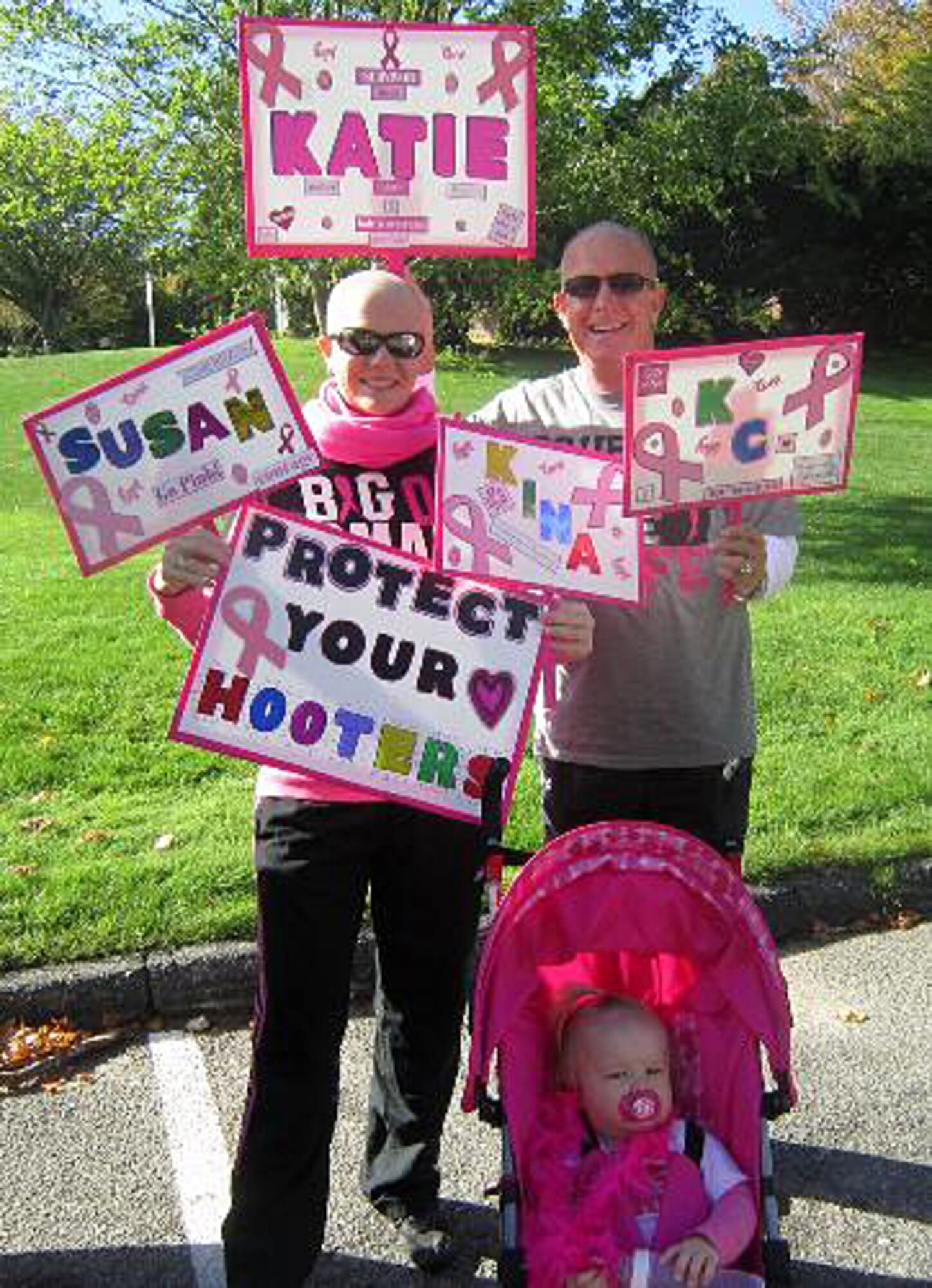Katie Hampton, Osan Middle School special education teacher and breast cancer survivor, Dave Hampton, her father, and her daughter, Abigale, show their fighting spirit at the Cape Cod “Making Strides Against Breast Cancer” Walk, Cape Cod, Mass., Oct. 22, 2012. Hampton credits her success at beating cancer to the overwhelming support of her family, friends and coworkers, both in the Republic of Korea and in the U.S. (Courtesy photo/Katie Hampton)