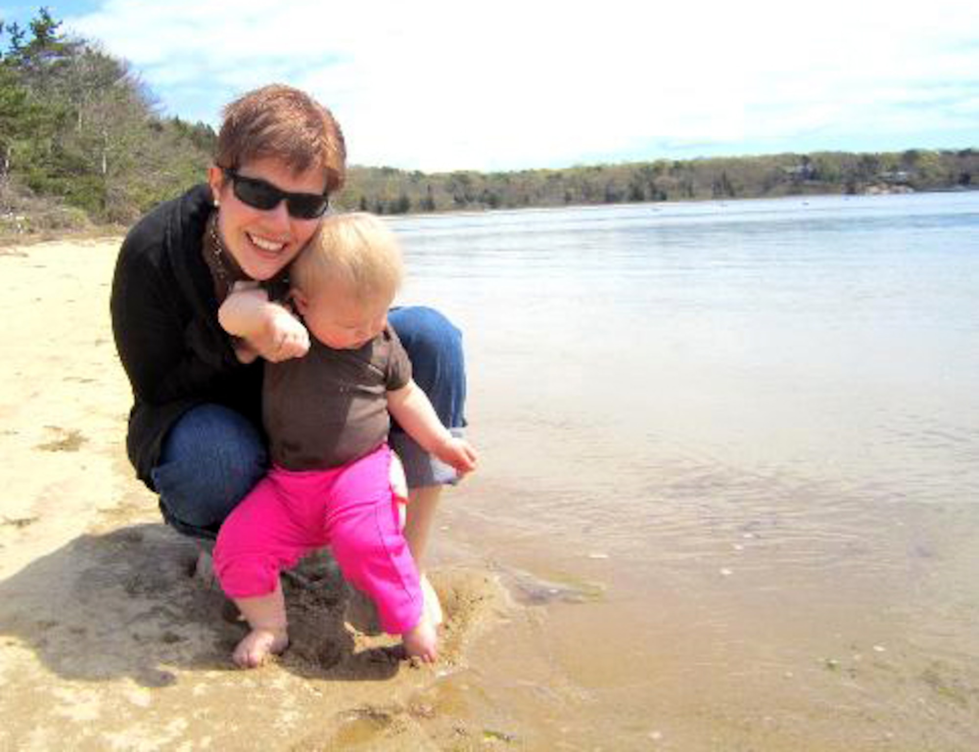 Katie Hampton, Osan Middle School special education teacher and breast cancer survivor, and her daughter, Abigale, test the water at Waquiot Bay, Mass., May 7, 2012. Hampton stayed with several family members, including her aunt, Rev. Nell Fields, during her cancer treatment at Massachusetts General Hospital. (Courtesy photo/Katie Hampton)