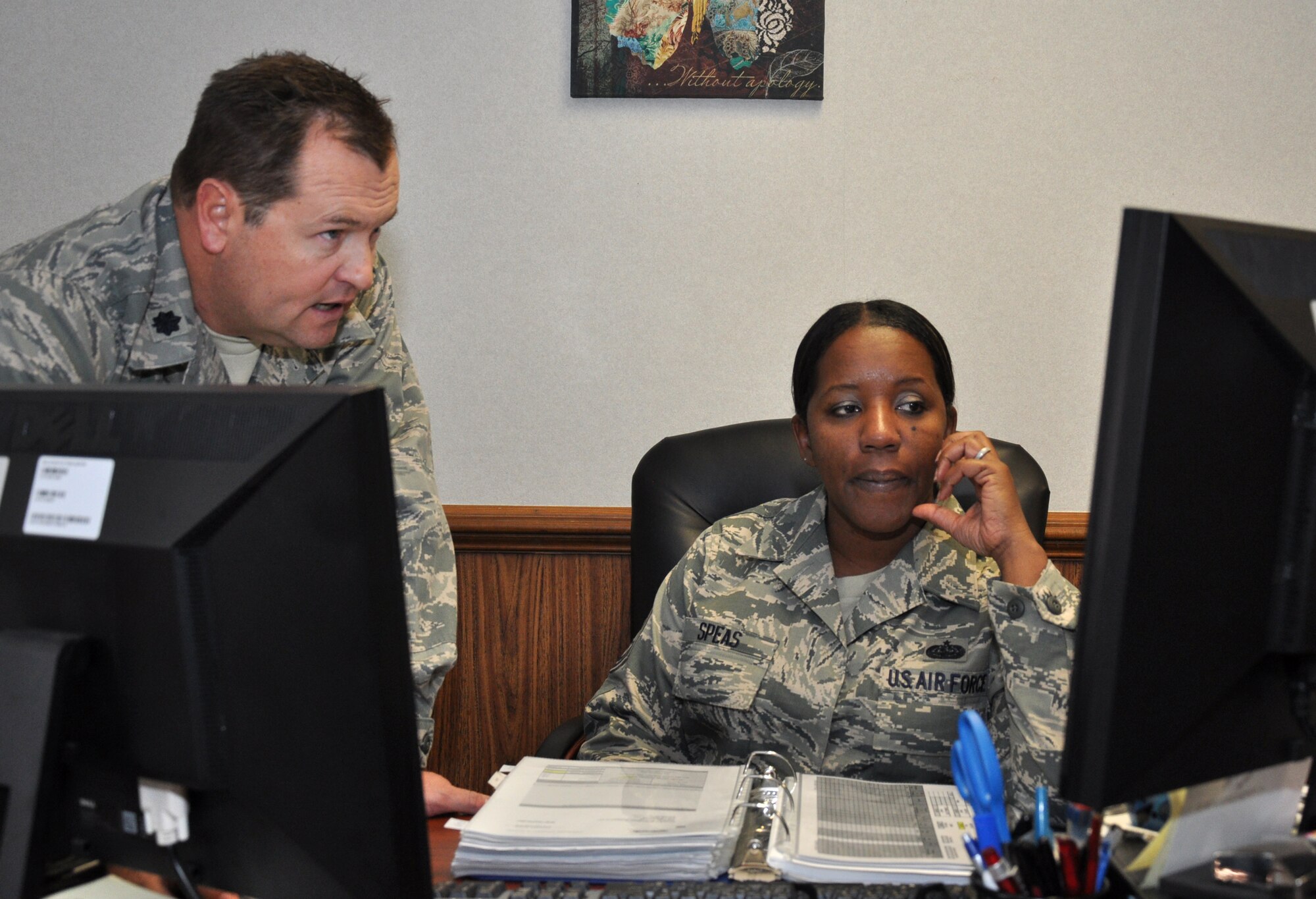 Master Sgt. Diane Speas, 916th Mission Support Group knowledge operations manager works with Lt. Col. James Clutter, 916th Civil Engineer Flight commander. Speas was recently promoted by the Air Force Reserve Command through the Promotion Enhancement Program. (USAF photo by SSgt. Alan Abernethy, 916ARW/PA)
 
