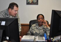 Master Sgt. Diane Speas, 916th Mission Support Group knowledge operations manager works with Lt. Col. James Clutter, 916th Civil Engineer Flight commander. Speas was recently promoted by the Air Force Reserve Command through the Promotion Enhancement Program. (USAF photo by SSgt. Alan Abernethy, 916ARW/PA)
 
