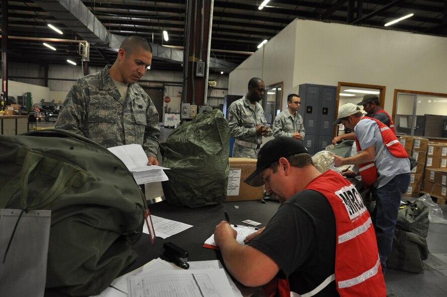 Members of the 940th Wing present gear for inspection at a deployment processing station during the Operational Readiness Inspection conducted by Air Combat Command at Beale Air Force Base, Calif. October 30th.  The ORI ensures unit readiness to process for deployment. (U.S. Air Force photo by Tech. Sgt. Heather Skinkle)