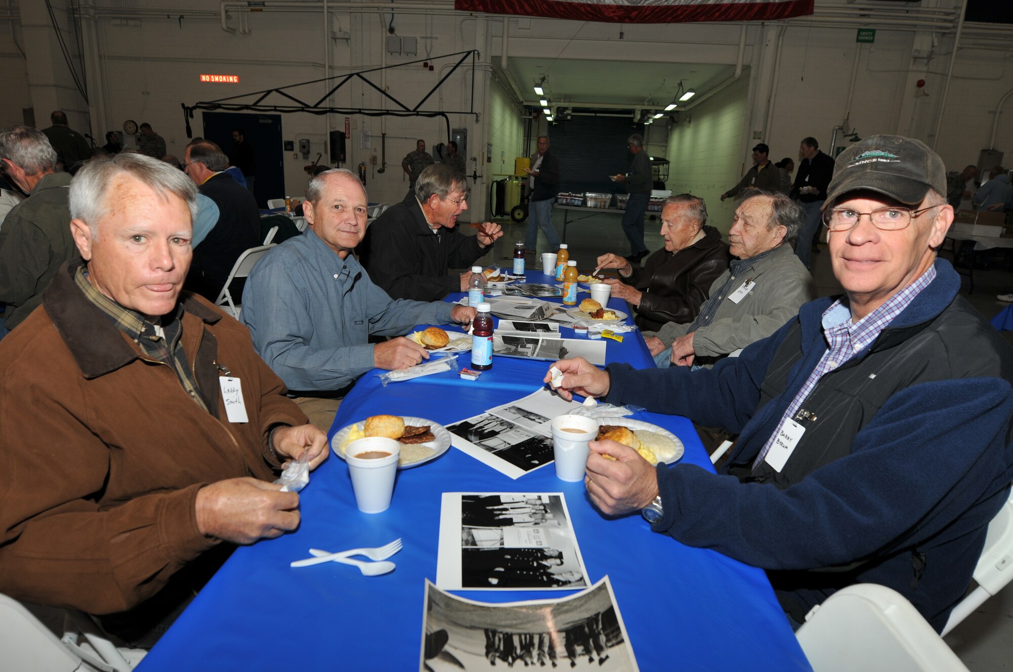 Retired Chief Master Sgt. William (Bill) Fish, (seated in back on the right) now 92, a former member of the 145th Aircraft Maintenance Squadron, joins other comrades, all retirees of the North Carolina Air National Guard, at the 18th Annual Retiree Breakfast held in a hanger at the North Carolina Air National Guard base, Charlotte-Douglas Intl. Airport  October 25, 2013.  Fish was one of five Senior Master Sgt.’s inducted into the Rank of Chief Master Sgt. and remained so for 19 years and 9 months before retiring in December 1980 after joining what is now the 145th Airlift Wing in 1948, a year after the Air Force was established.  (Air National Guard photo by Master Sgt. Patricia F. Moran/Released)