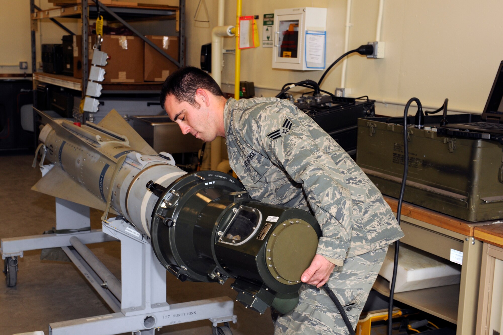 131102-Z-EZ686-211 -- Senior Airman Brant Long, 127th MXS Munitions, conducts an inspection and maintenance on the air to ground Training Guided Missile 65 otherwise known as the “Maverick” at Selfridge Air National Guard Base, Mich., Nov. 2, 2013. Long has been in Munitions since 2009 and said he enjoys working with his fellow coworkers on drill weekends. (U.S. Air National Guard photo by MSgt. David Kujawa / Released)