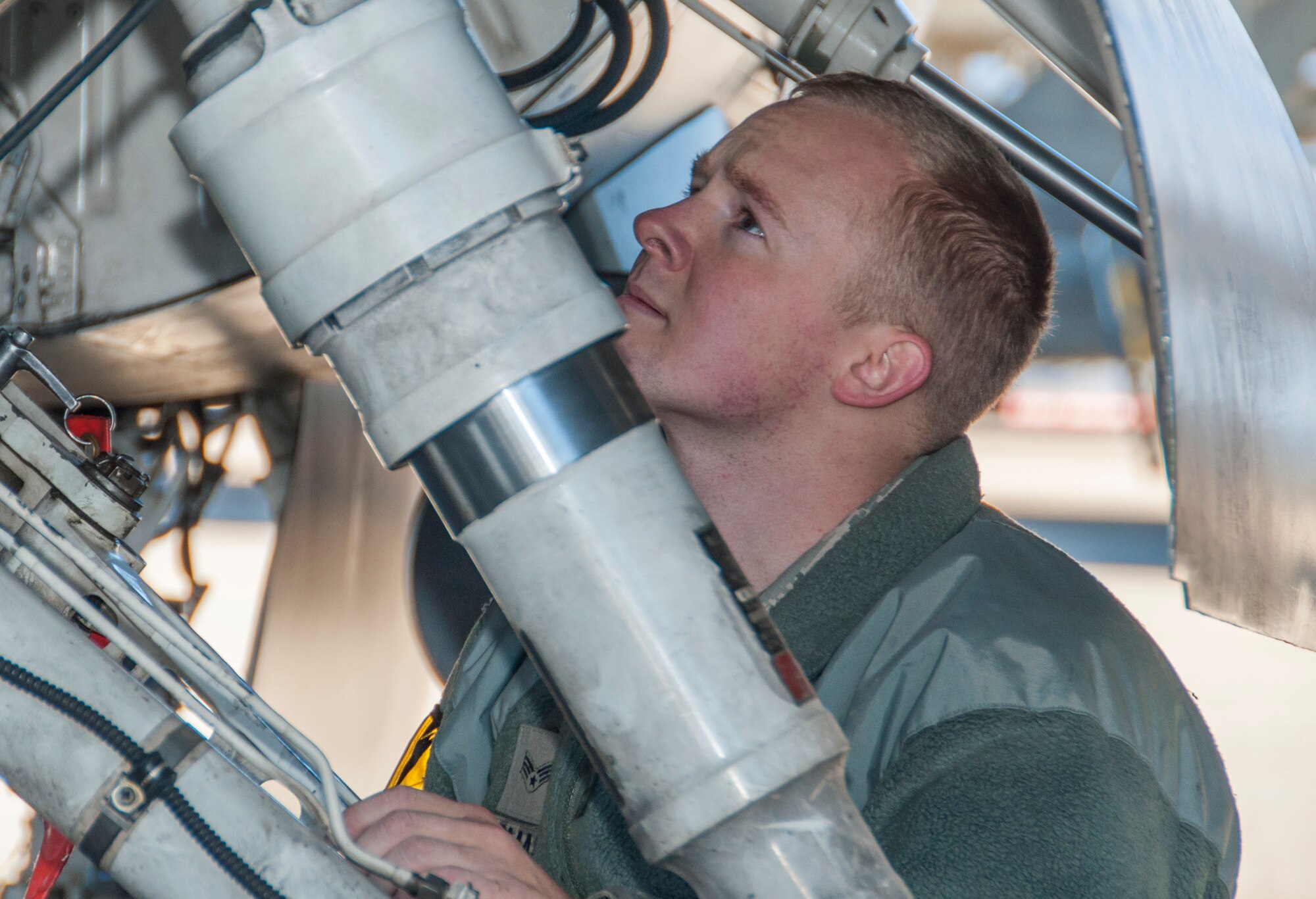 Senior Airman Cameron Kidman, a 419th crew chief, performs a post-flight inspection of an F-16’s hydraulic system. Maintainers must examine the aircraft after each flight to ensure it is properly preserved. Cameron, along with other members of the 419th operations and maintenance groups participated in surge operations, launching 30 training flights in one day. (U.S. Air Force photo/Senior Airman Crystal Charriere)